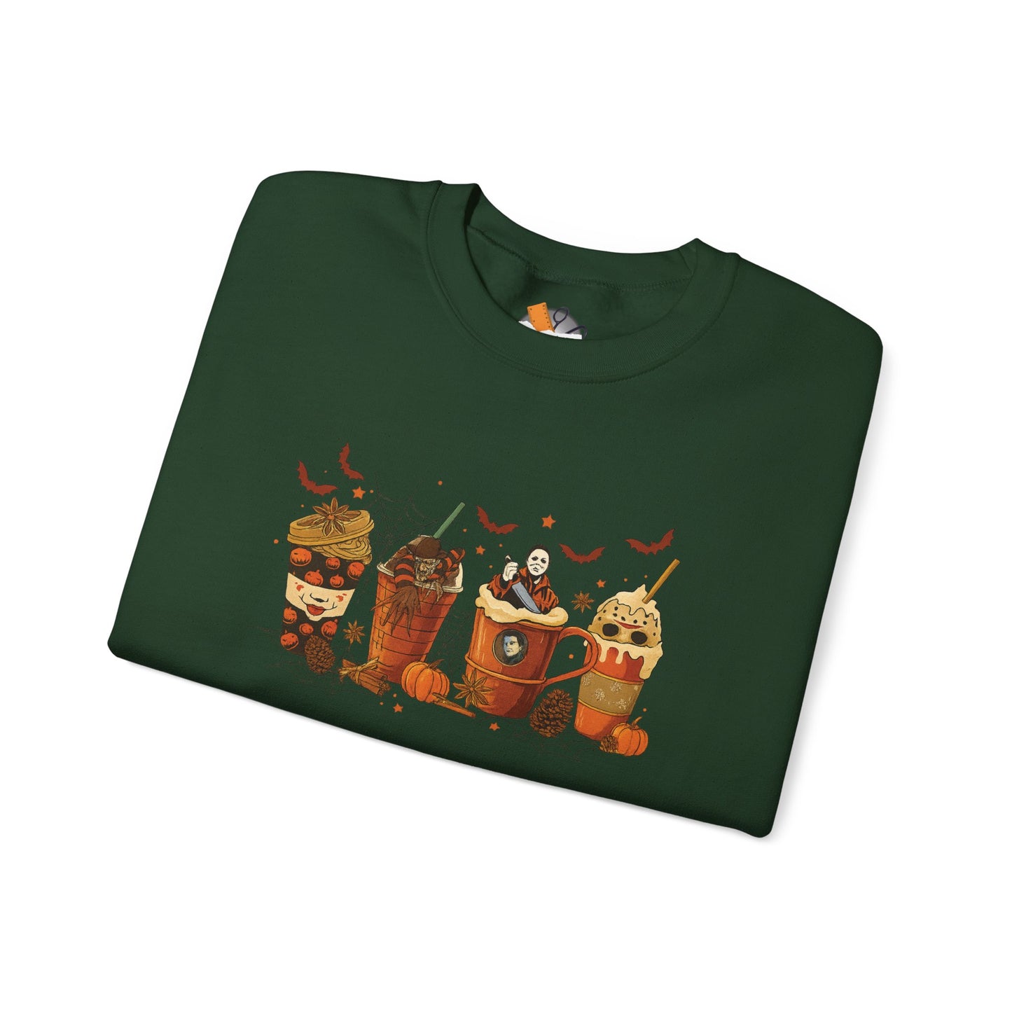 Folded dark green Gildan 18000 crewneck sweatshirt with Halloween horror coffee drinks graphic featuring spooky characters and fall accents.
