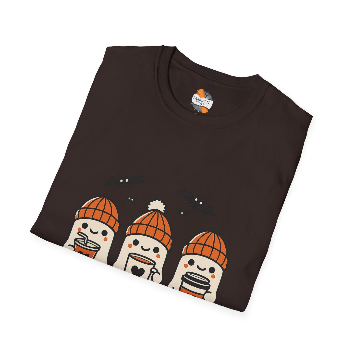 Folded brown Halloween graphic t-shirt featuring three cute ghosts in orange beanies holding coffee mugs, Makin’ It By Lady Ev.