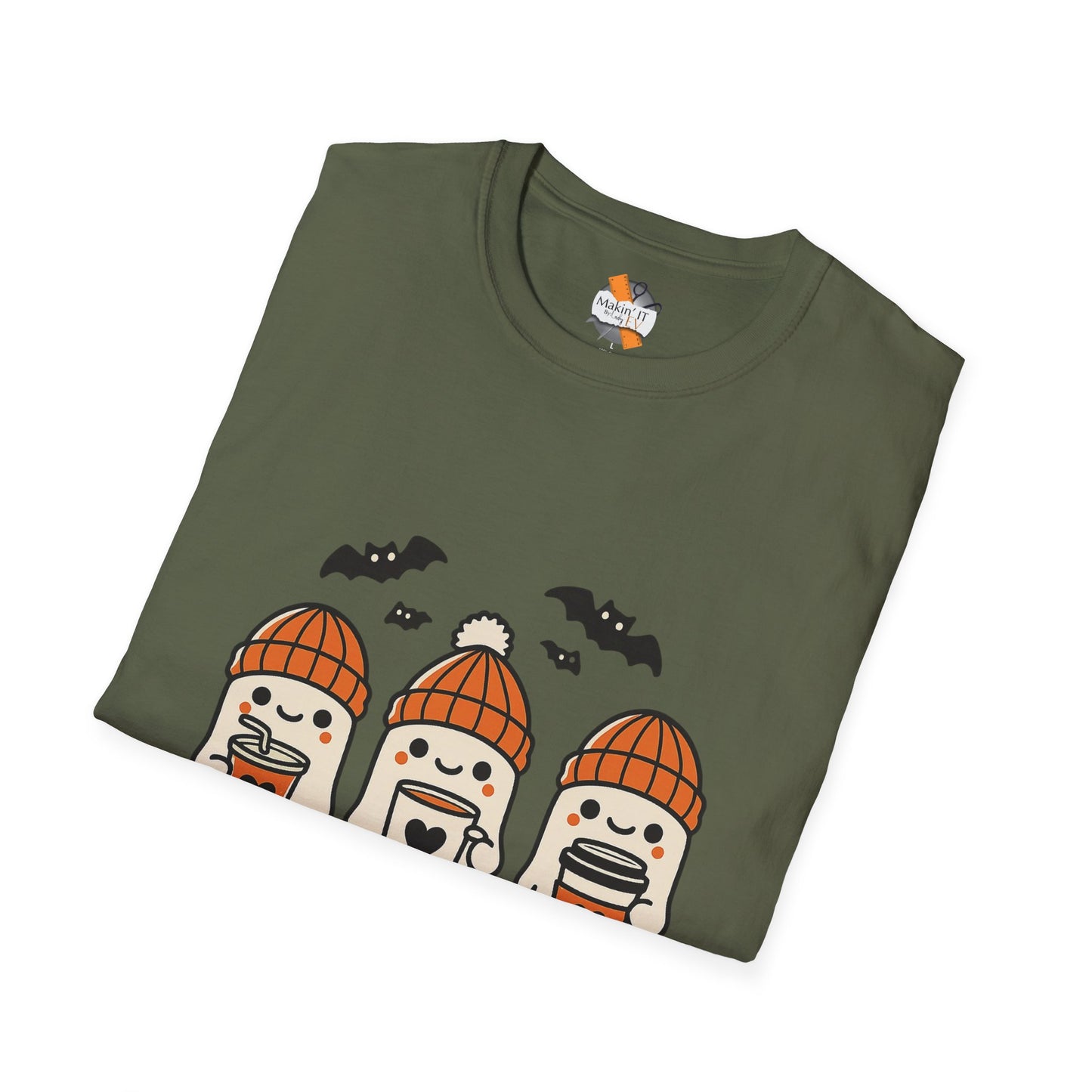 Folded olive green Halloween t-shirt with ghost trio wearing orange beanies holding drinks, Makin’ It By Lady Ev
