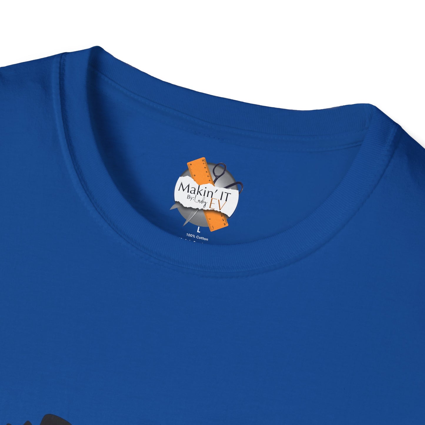 Close-up of royal blue Halloween t-shirt neckline showing Makin’ It By Lady Ev branded tag and soft cotton fabric.