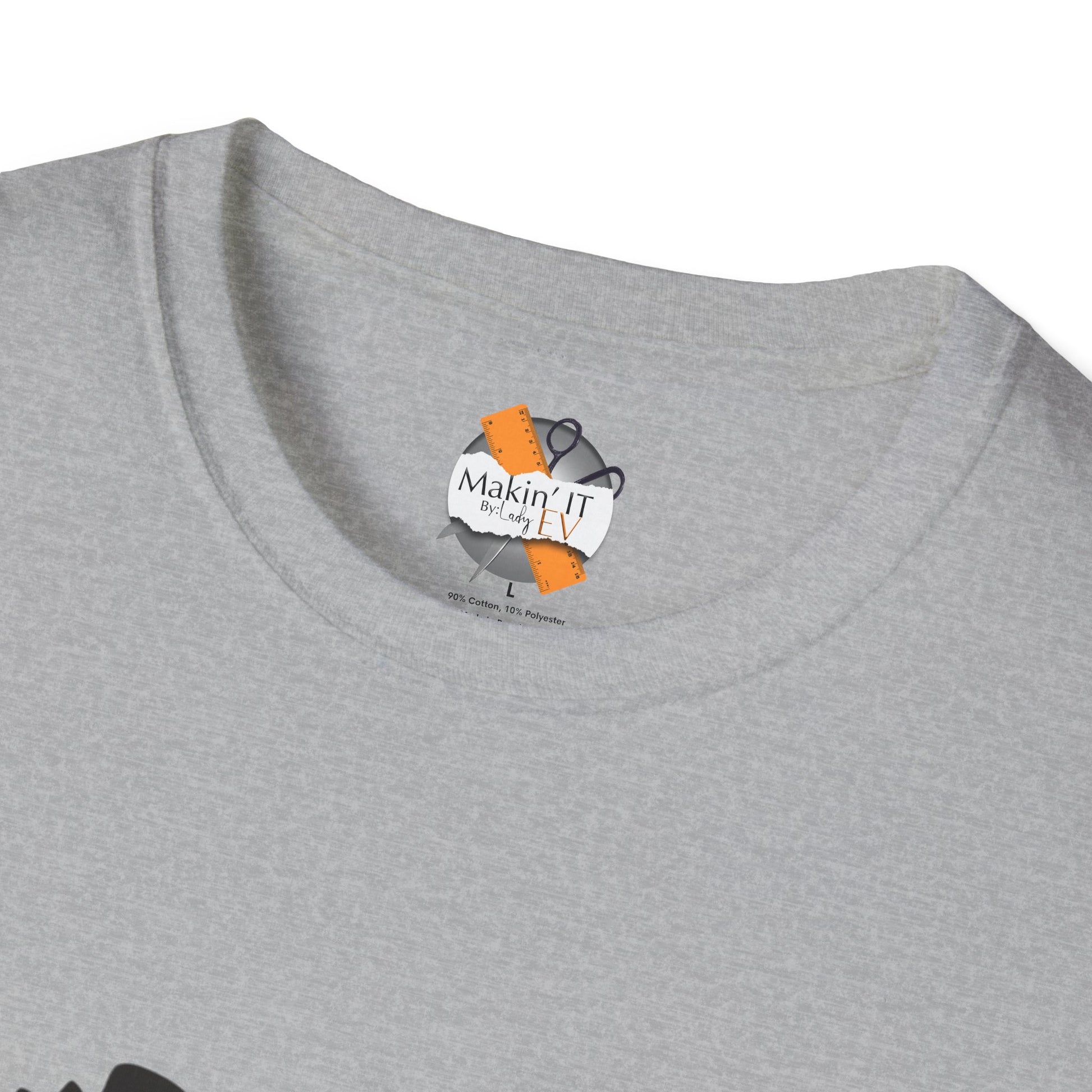 Close-up neckline of heather gray Halloween t-shirt with Makin’ It By Lady Ev custom label and ghost beanie print.