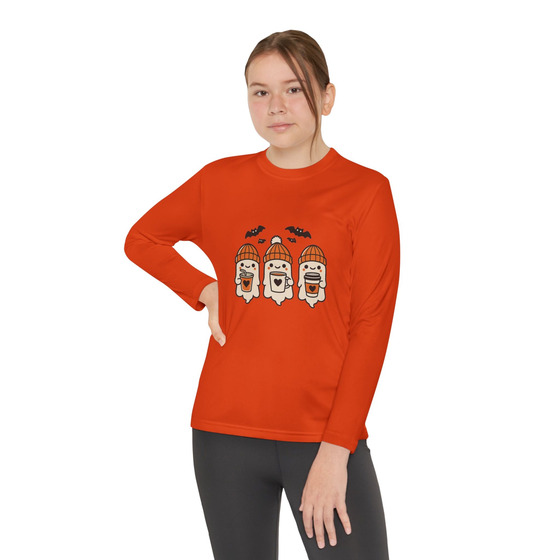 Young Female model wearing orange ghost beanie Halloween long sleeve shirt – cozy fall season tee by Makin’ It By Lady Ev.