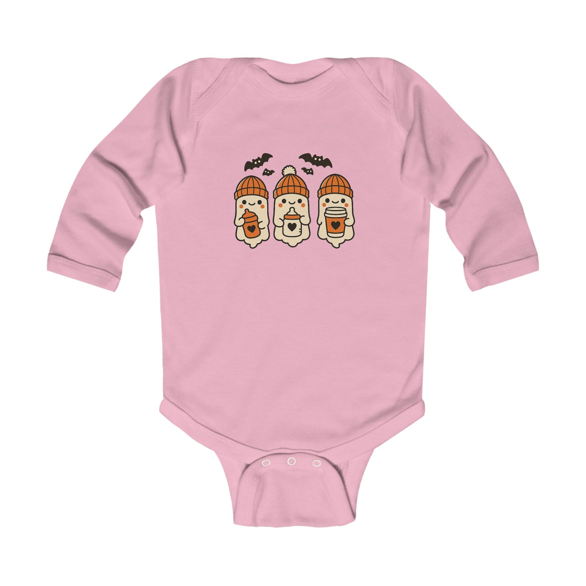 Soft pink baby onesie featuring cute ghost trio in orange winter beanies, each holding a baby bottle or sippy cup, surrounded by flying bats.