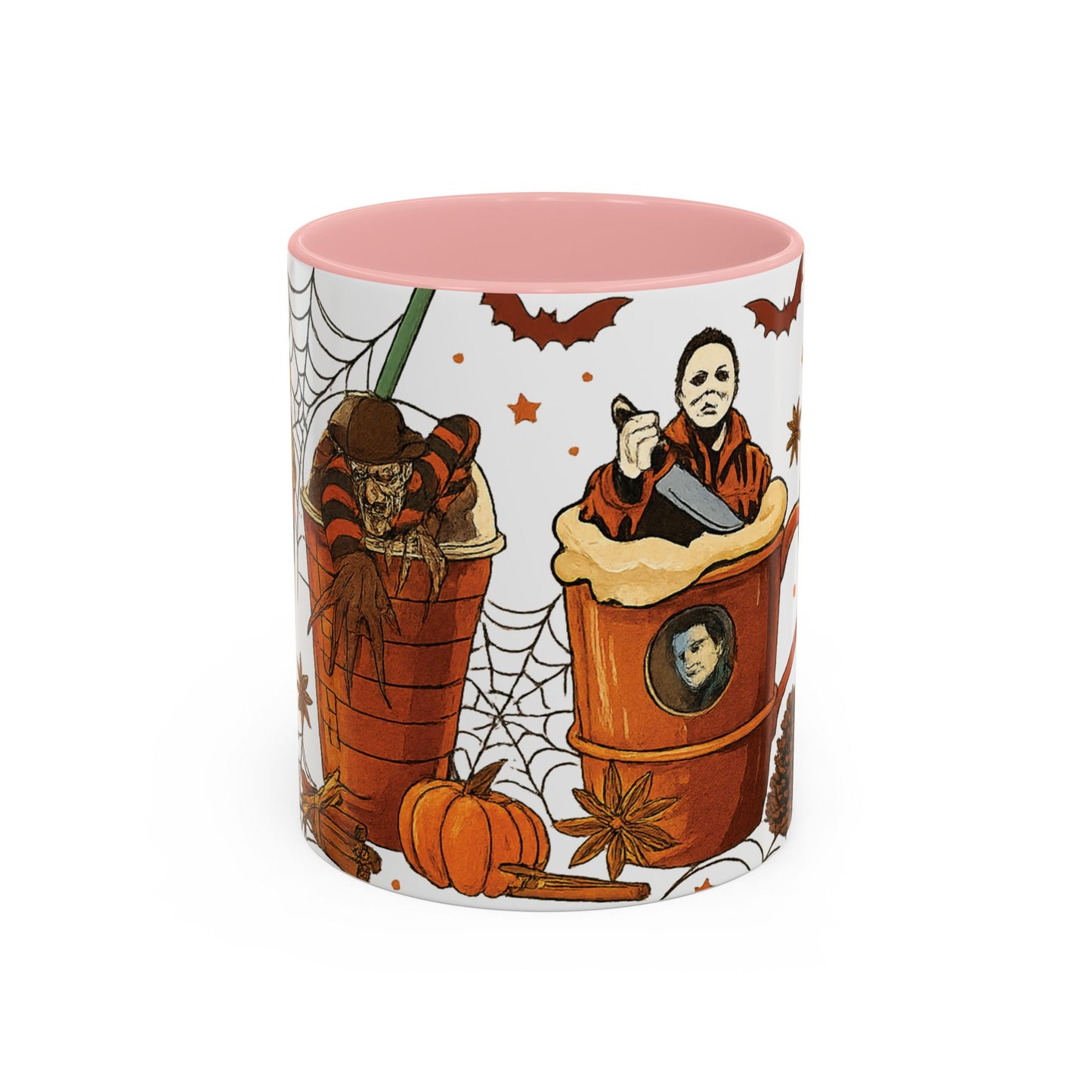 Cute spooky pink inside Halloween coffee mug with horror villains Freddy Krueger and Michael Myers in festive coffee cup design.