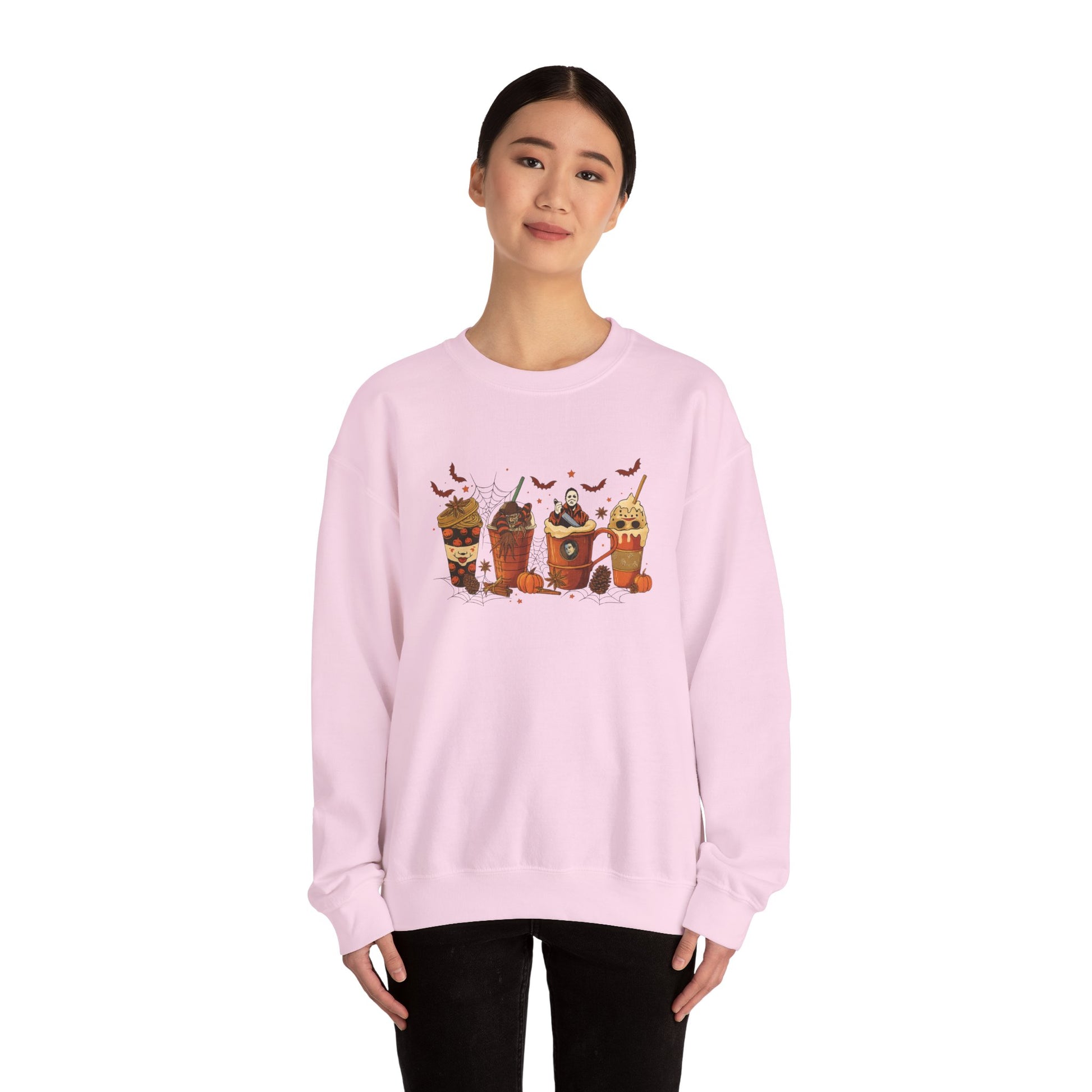 Light pink Gildan 18000 unisex crewneck sweatshirt with Halloween horror coffee drinks design, shown on model for fit and style.