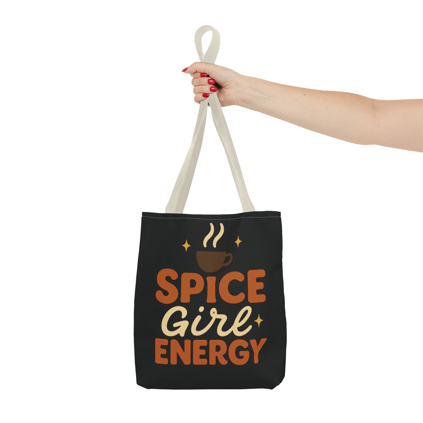 Beige-handled black “Spice Girl Energy” tote bag held in hand — stylish coffee-lover tote bag for fall outfits and daily errands.