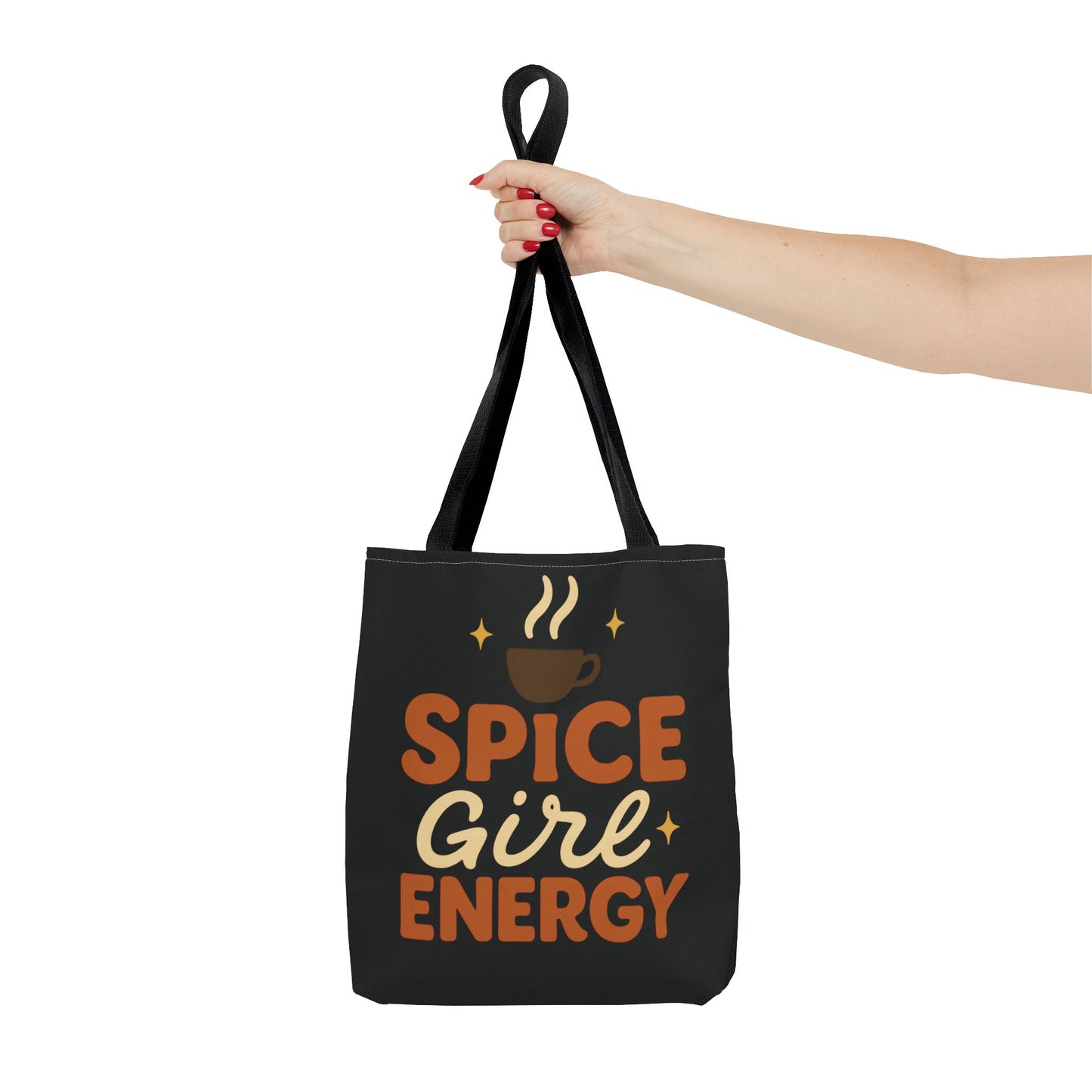 Black “Spice Girl Energy” tote bag held by black handles — stylish autumn tote for coffee lovers and daily use.