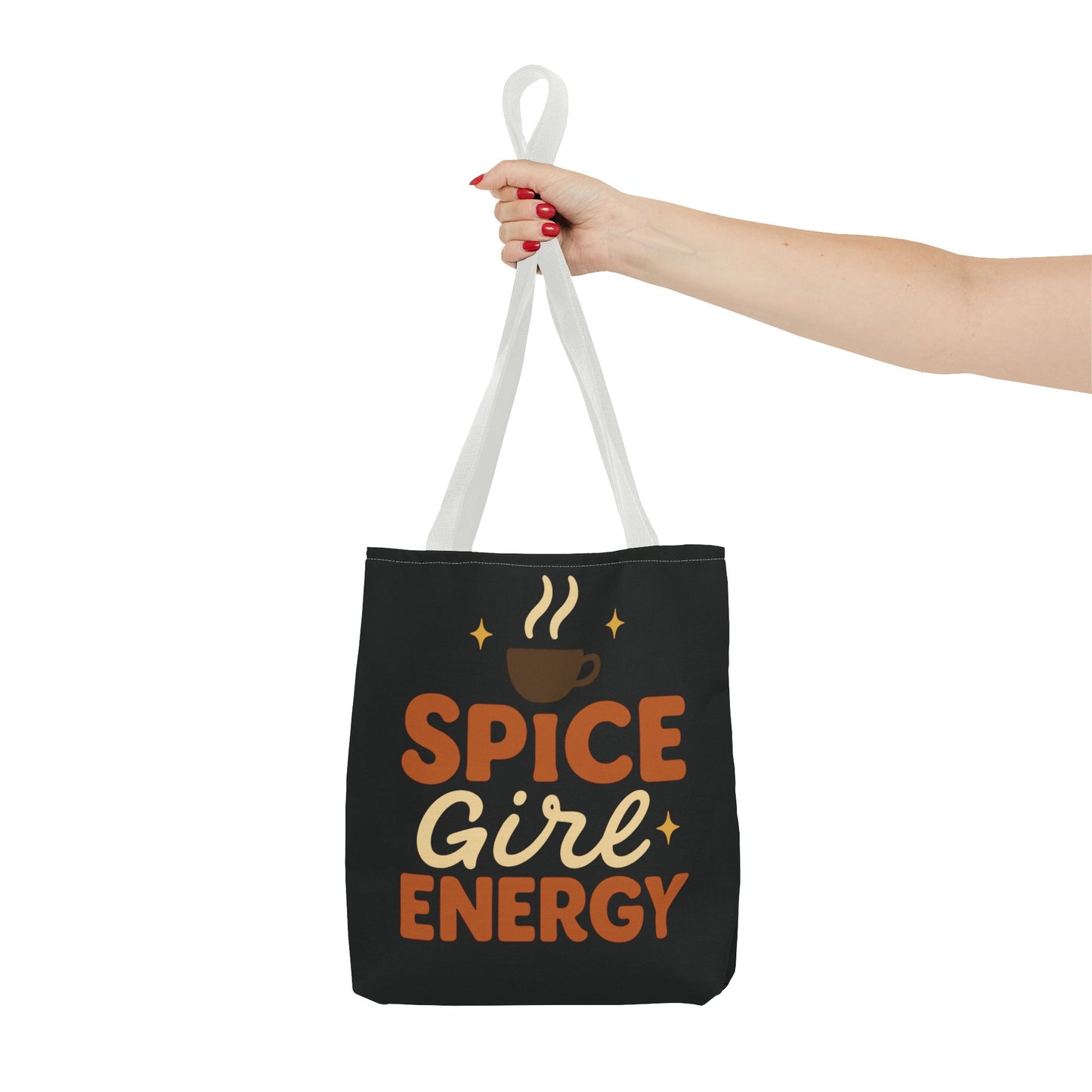 White-handled black “Spice Girl Energy” tote bag held in hand — cozy fall tote for daily coffee lovers and autumn adventures.