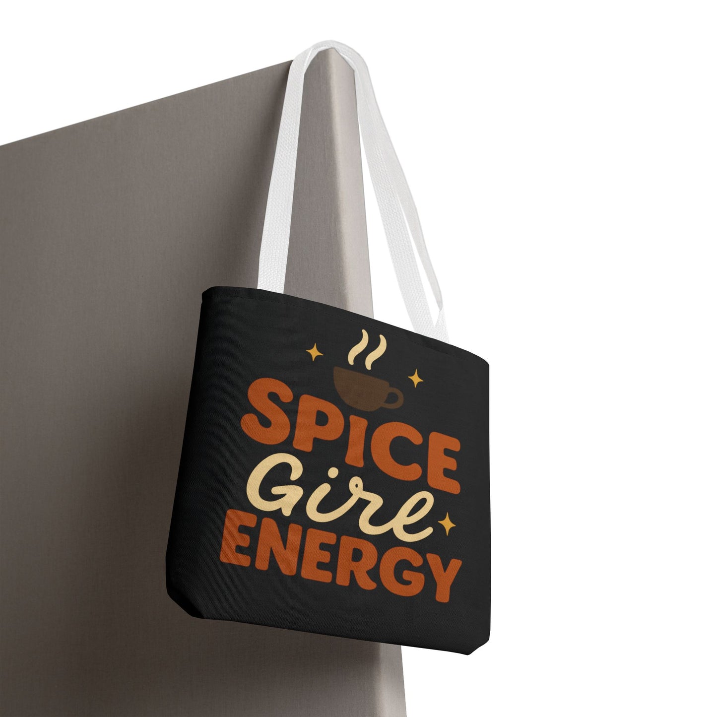 “Spice Girl Energy” tote bag in black with white straps hanging — stylish coffee-inspired tote bag for gifting and fall fashion.