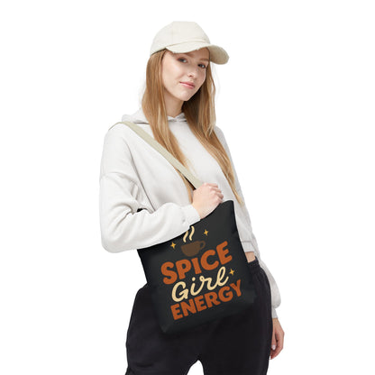 Woman wearing black “Spice Girl Energy” tote bag with beige handles — coffee-inspired fall tote for cozy everyday style.