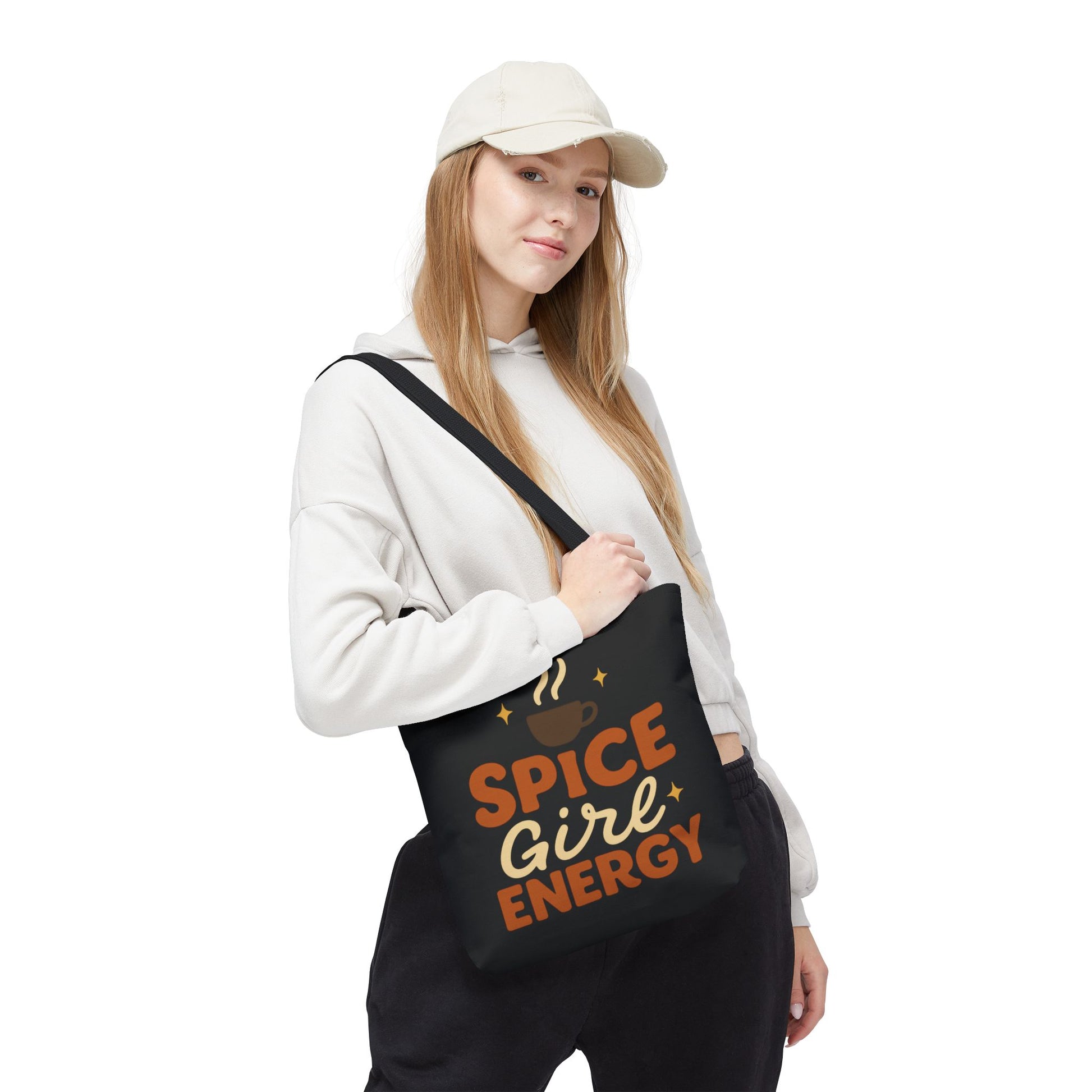 Woman wearing black “Spice Girl Energy” tote bag with black straps — modern coffee aesthetic tote for cozy fall outfits.