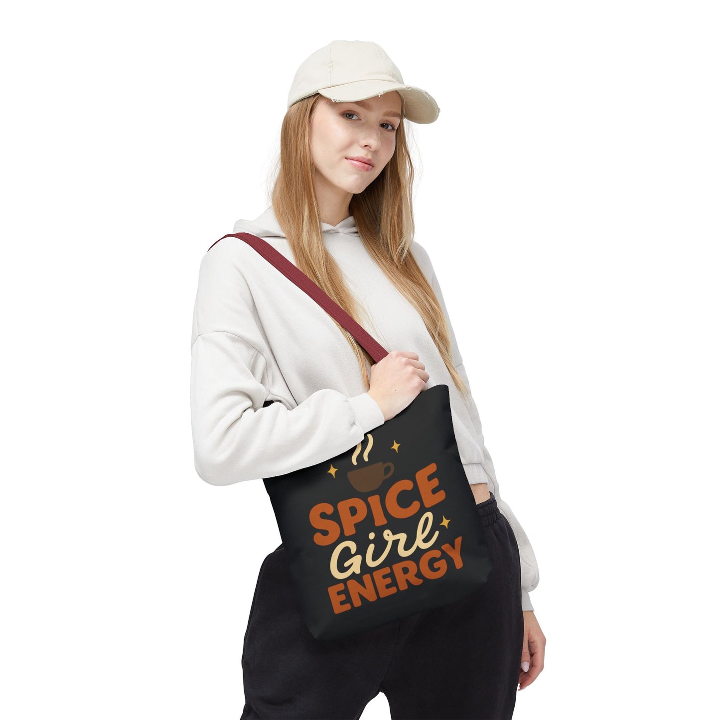Woman wearing black “Spice Girl Energy” tote bag with red handles — stylish fall tote for cozy coffee runs and casual outfits.