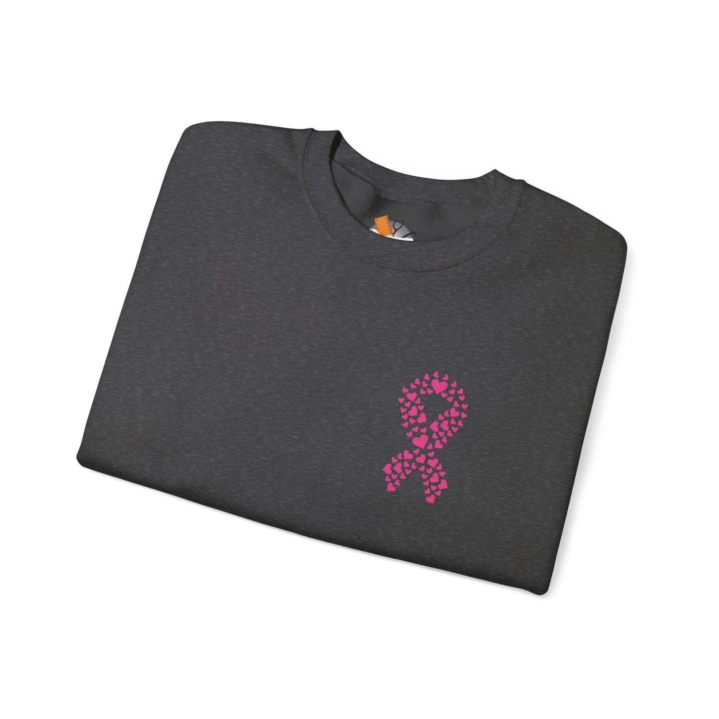 Folded charcoal gray crewneck sweatshirt with pink heart ribbon design for breast cancer awareness, Makin’ It by Lady Ev.