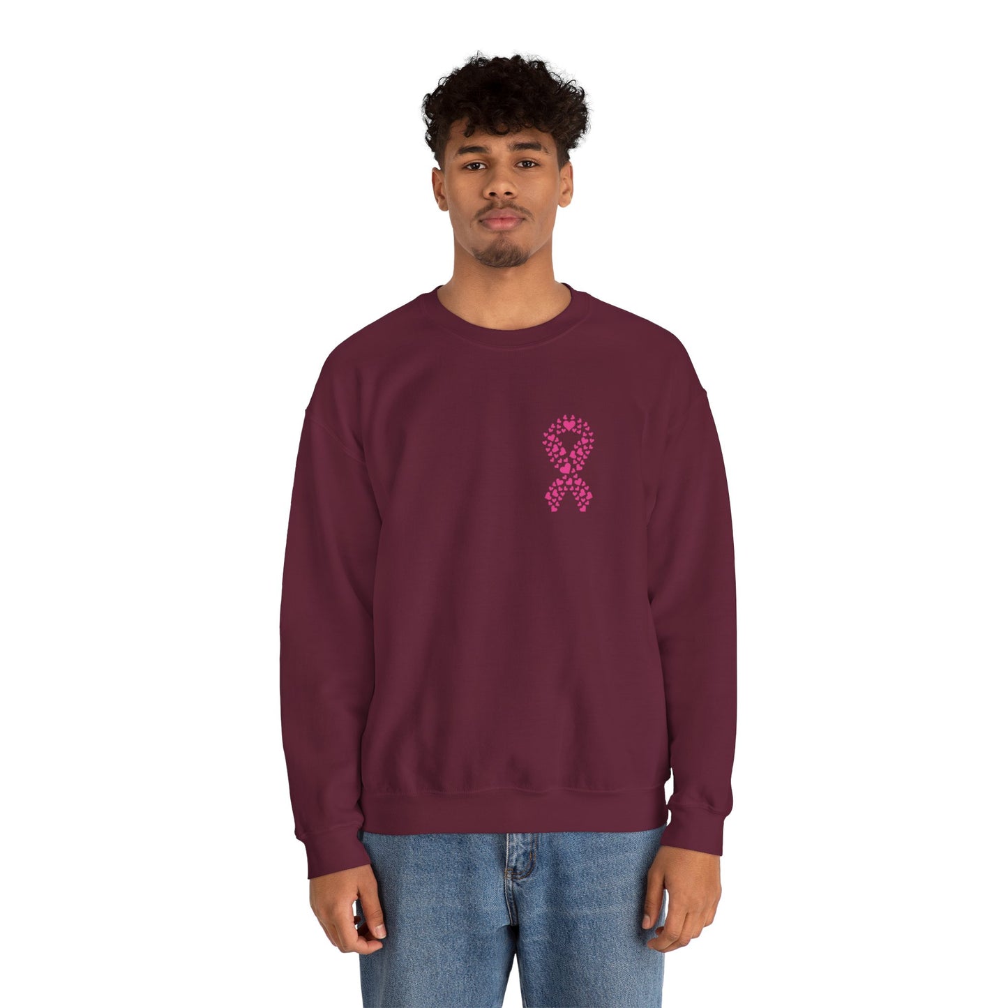 Man wearing maroon breast cancer awareness crewneck sweatshirt with pink ribbon of hearts graphic, Makin’ It by Lady Ev.