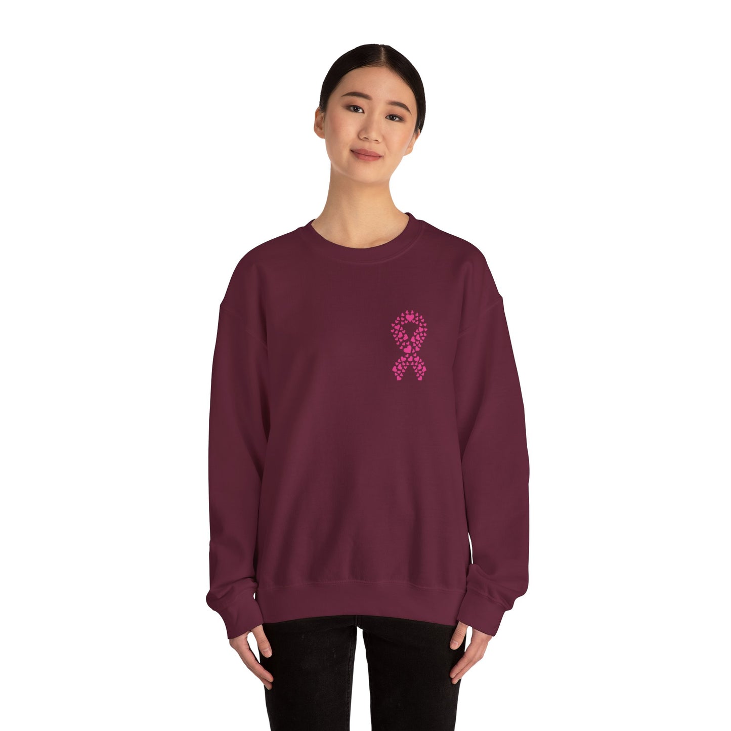 Woman wearing maroon breast cancer awareness crewneck sweatshirt with pink ribbon made of hearts, Makin’ It by Lady Ev.