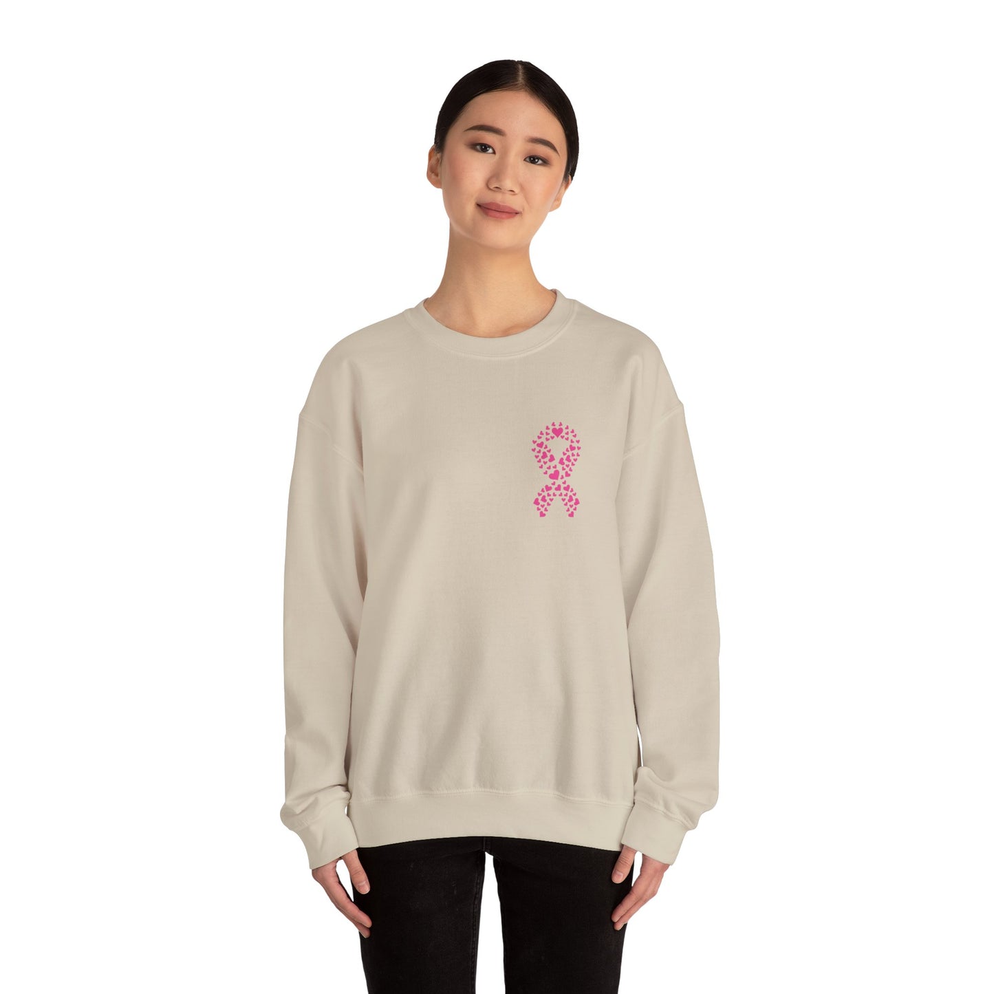 Woman wearing sand breast cancer awareness crewneck sweatshirt with pink ribbon made of hearts, Makin’ It by Lady Ev.
