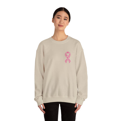 Woman wearing sand breast cancer awareness crewneck sweatshirt with pink ribbon made of hearts, Makin’ It by Lady Ev.