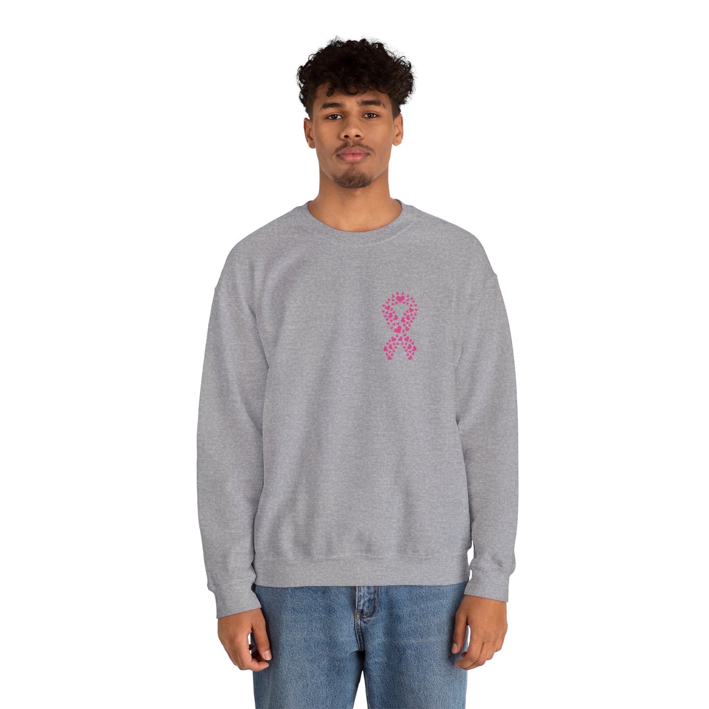 Man wearing sport gray breast cancer awareness crewneck sweatshirt with pink heart ribbon design, Makin’ It by Lady Ev.