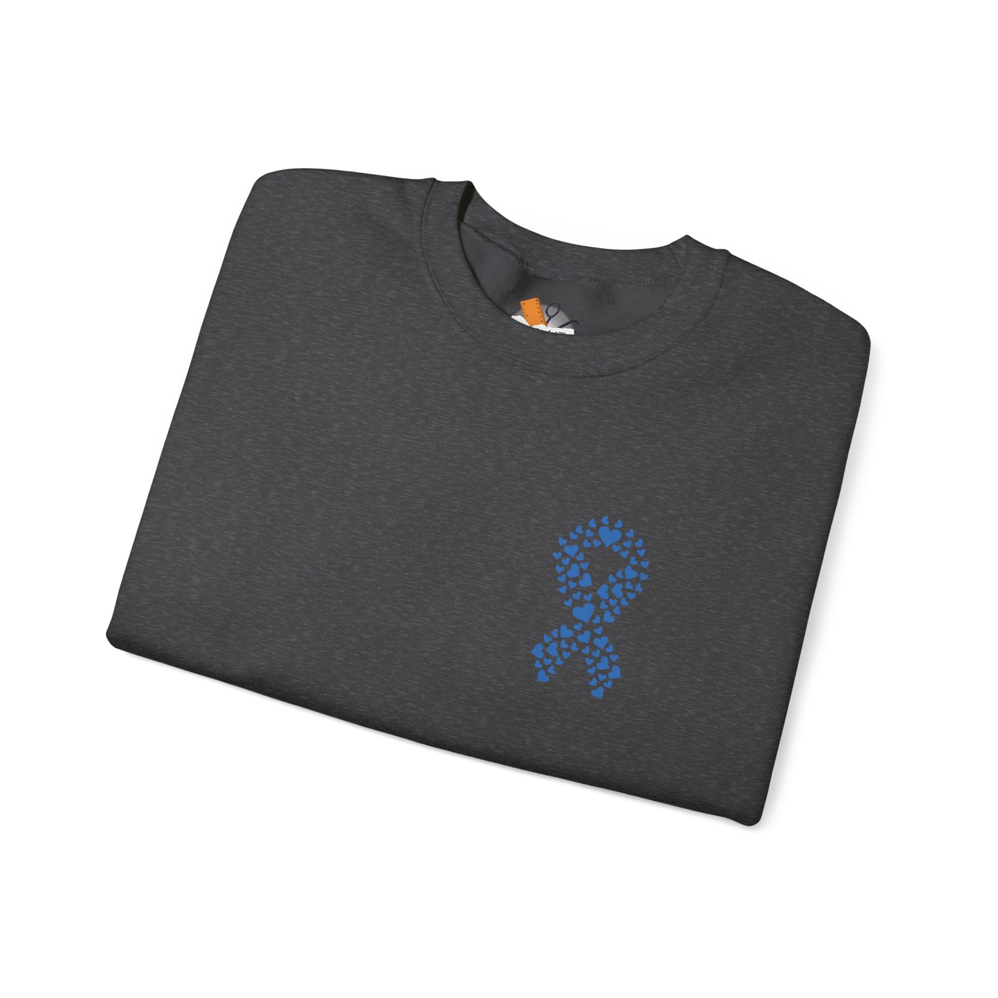 Folded dark heather gray diabetes awareness sweatshirt with blue heart ribbon — cozy crewneck promoting unity and awareness.