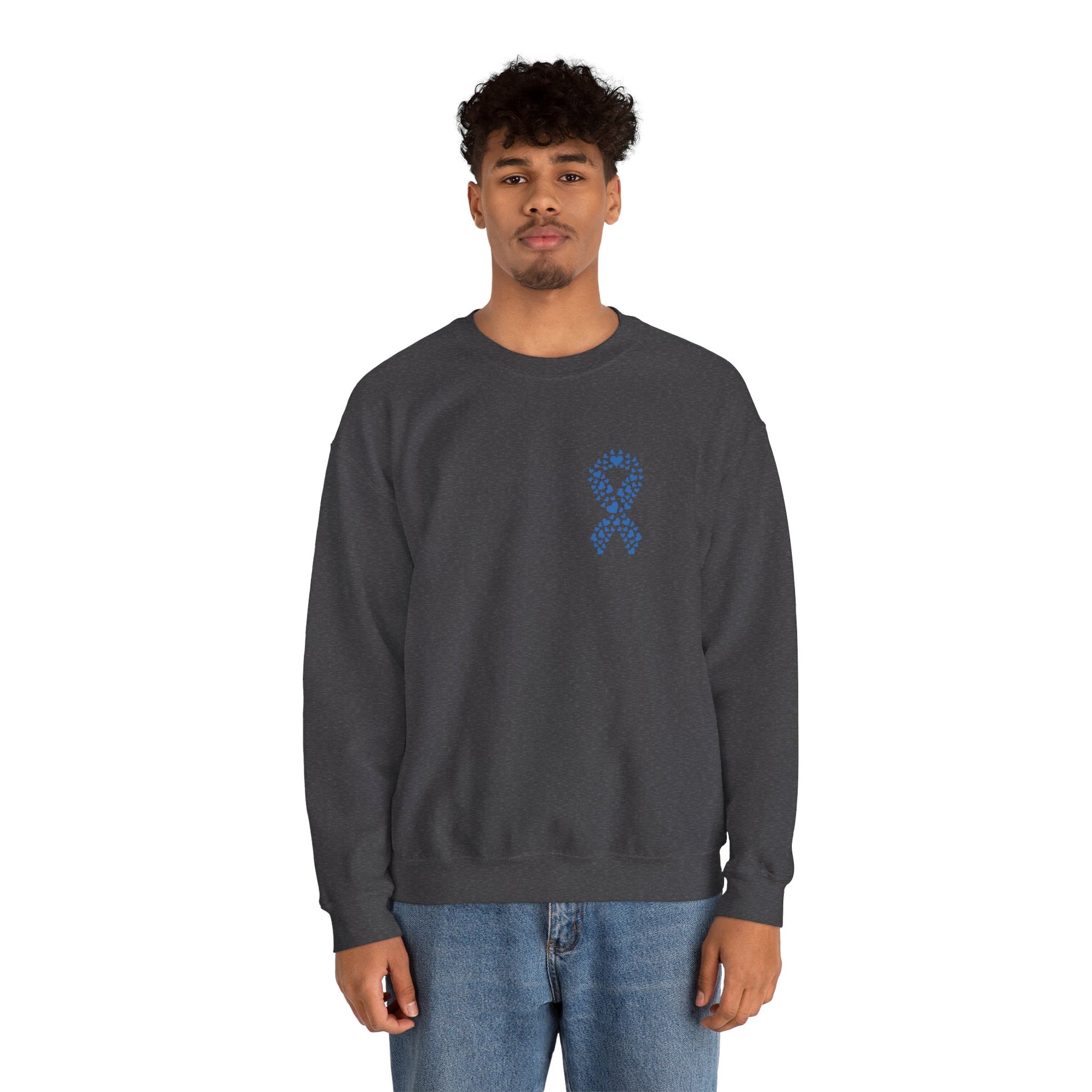 Man modeling dark heather gray diabetes awareness sweatshirt — classic unisex crewneck with blue heart ribbon emblem for awareness.