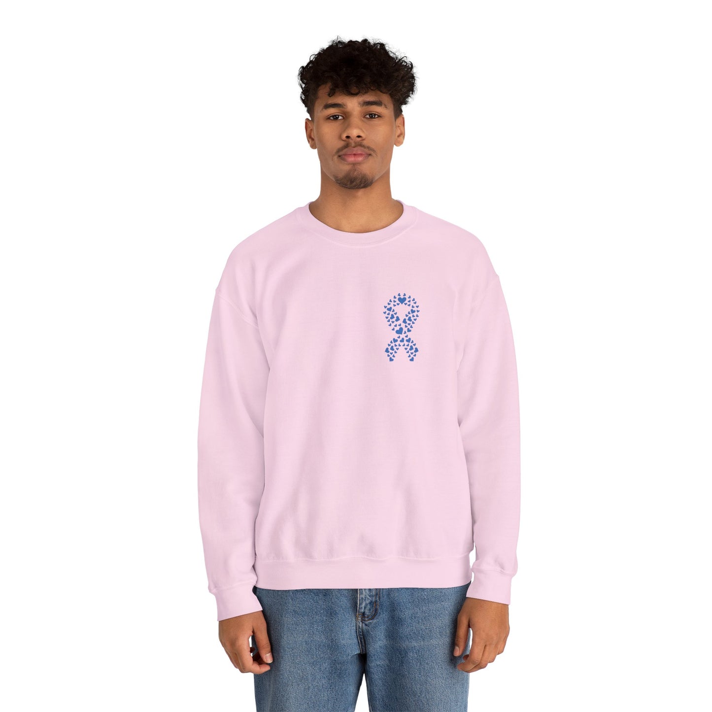Man modeling light pink diabetes awareness sweatshirt featuring blue heart ribbon — cozy unisex crewneck to spread awareness.