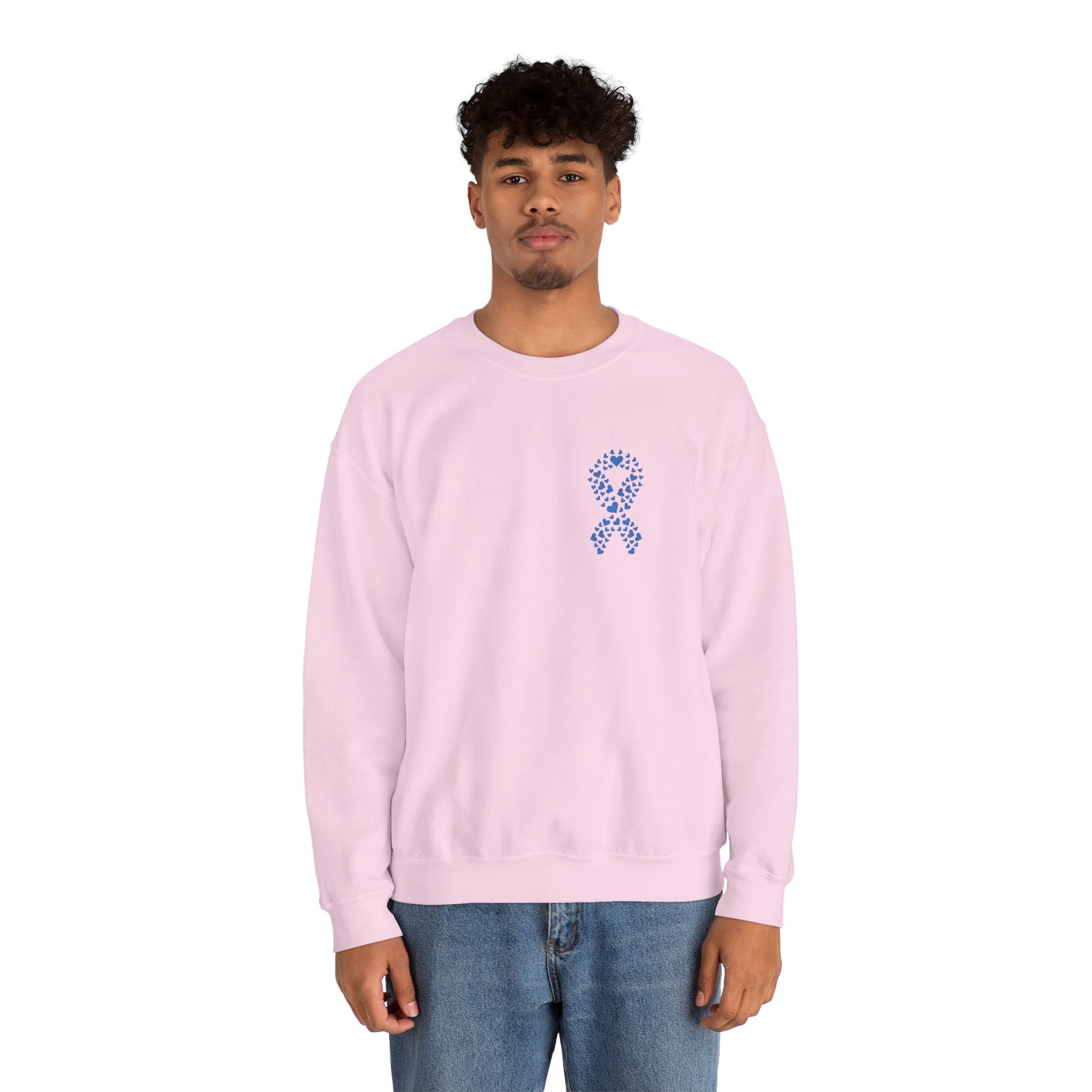 Man modeling light pink diabetes awareness sweatshirt featuring blue heart ribbon — cozy unisex crewneck to spread awareness.