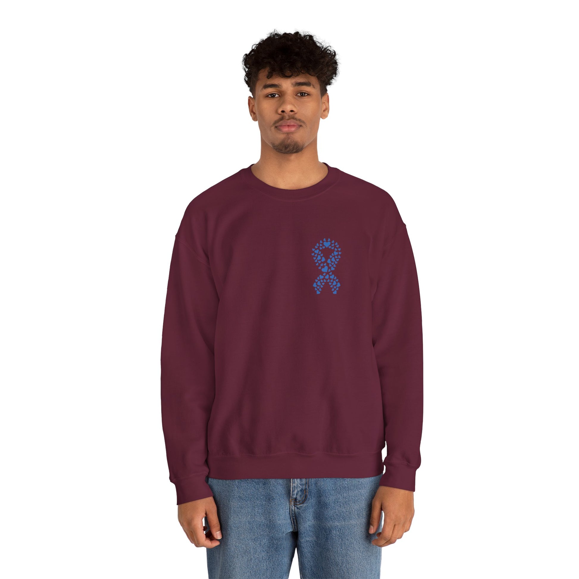 Man modeling maroon diabetes awareness crewneck sweatshirt — unisex sweatshirt with blue heart ribbon design supporting awareness and care.
