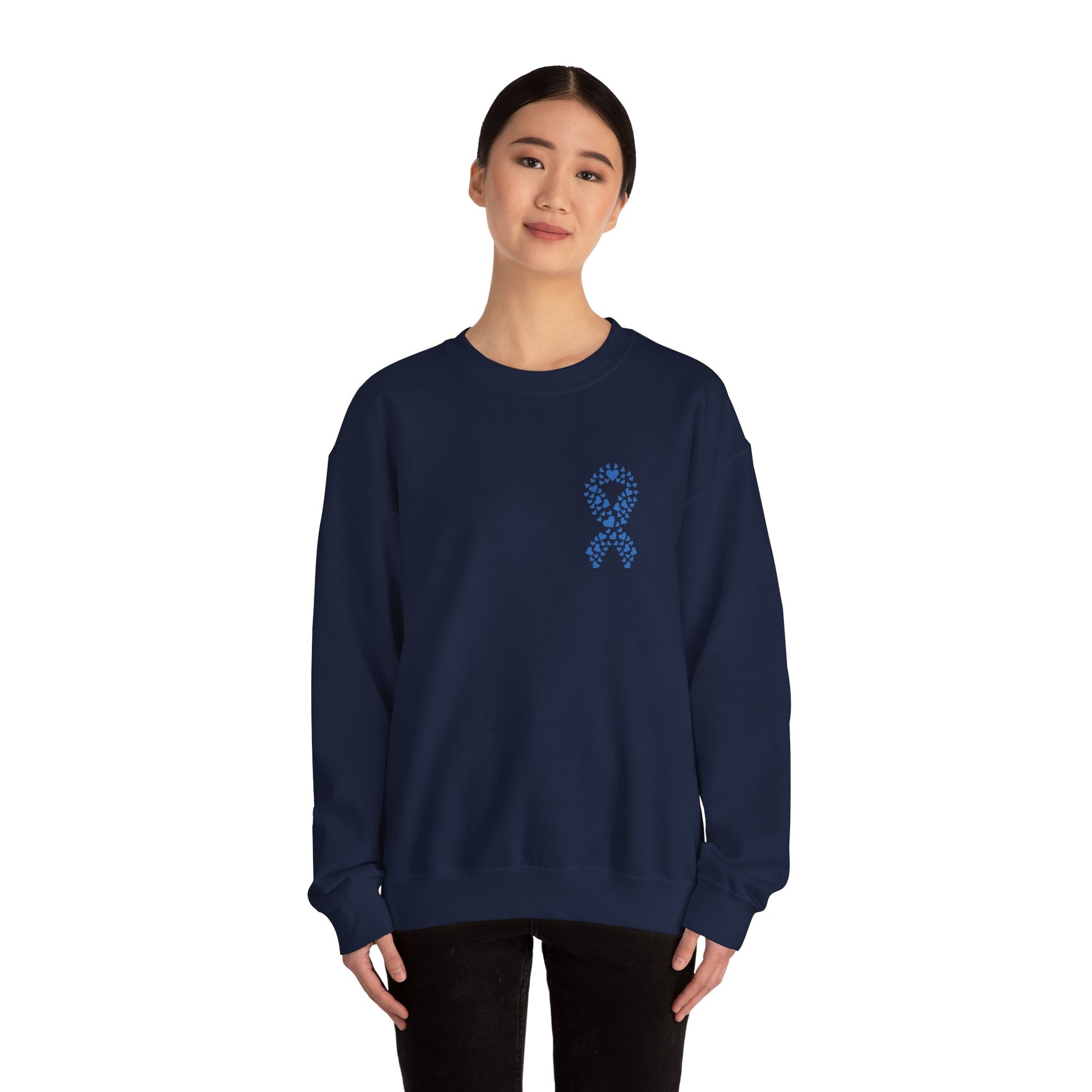 Woman wearing navy blue diabetes awareness crewneck sweatshirt — comfortable unisex top featuring a blue heart ribbon design.