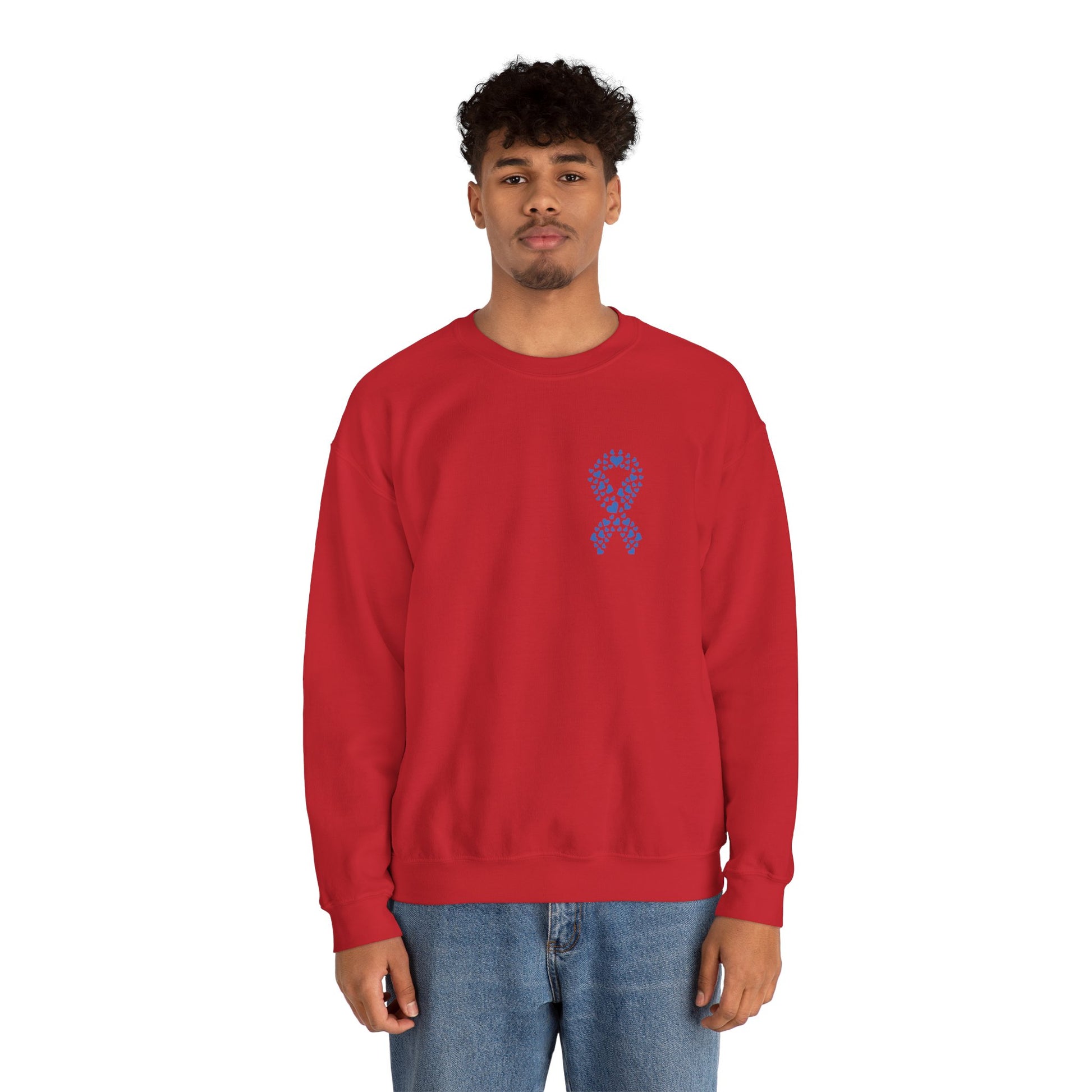 Man modeling red diabetes awareness sweatshirt — unisex crewneck with heart ribbon emblem supporting health and awareness.
