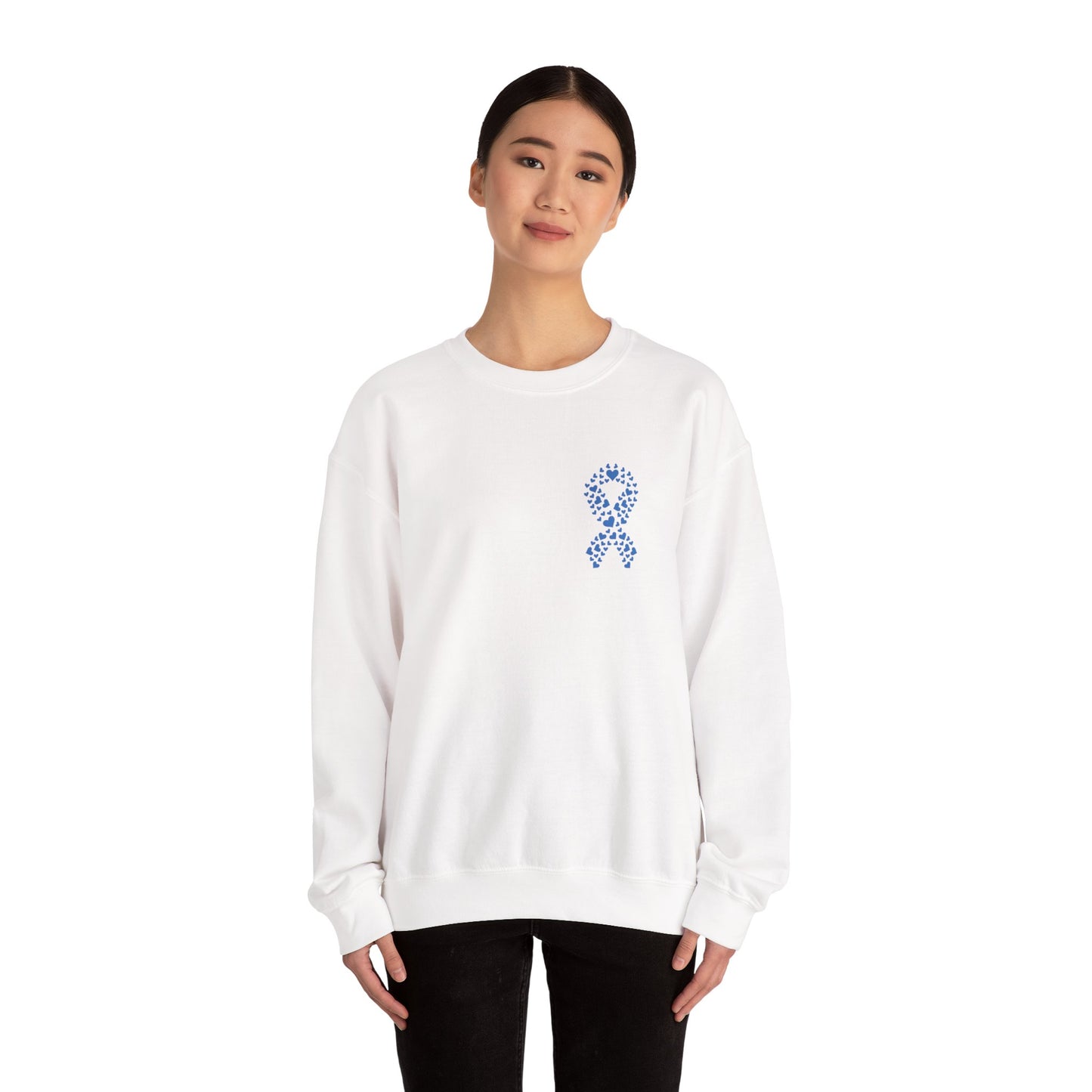 Woman wearing white diabetes awareness crewneck sweatshirt with blue heart ribbon — clean and classic unisex design promoting awareness.