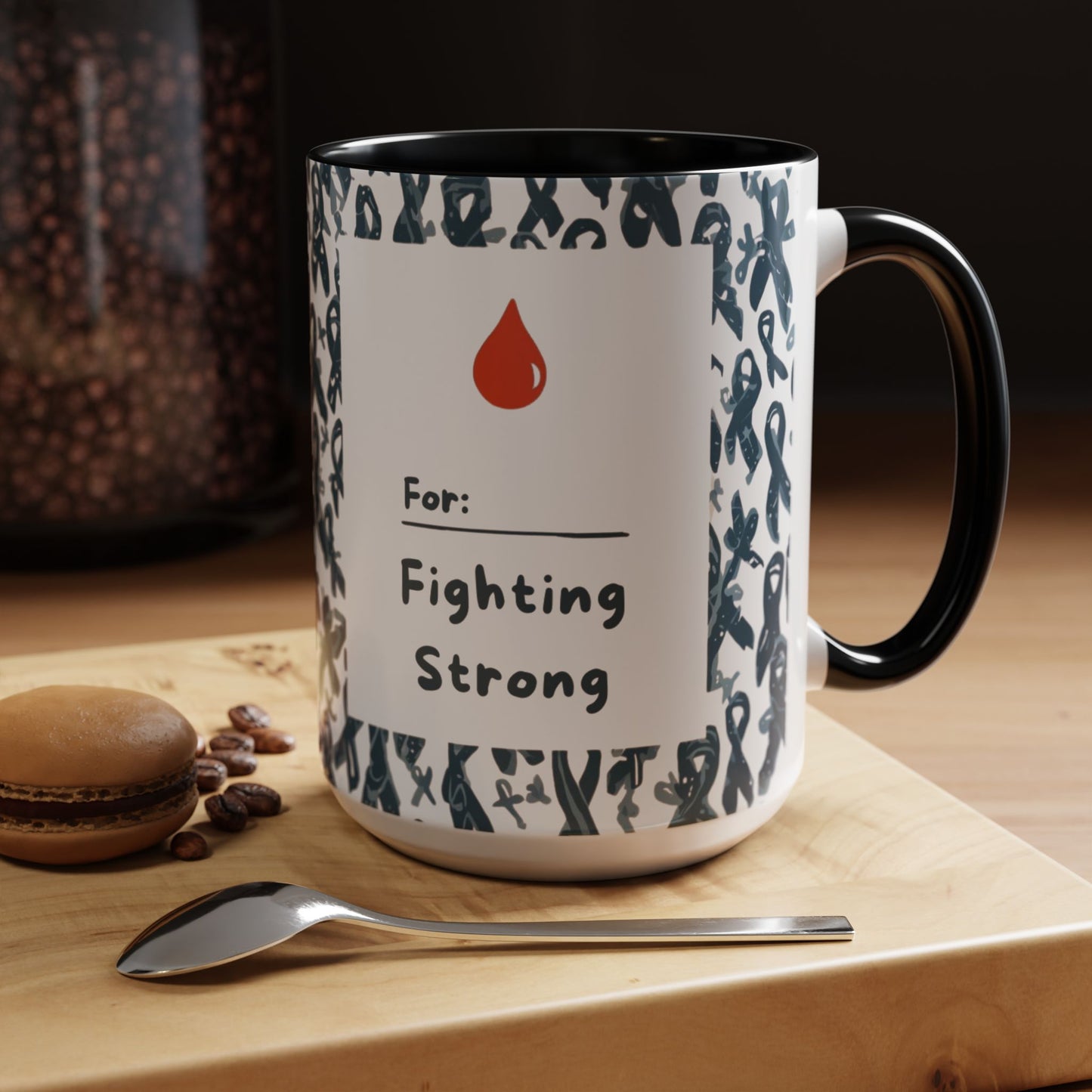 Black accent 15oz diabetes awareness mug on kitchen table beside coffee and macaron — “For: Fighting Strong” design symbolizing courage, self-care, and advocacy.