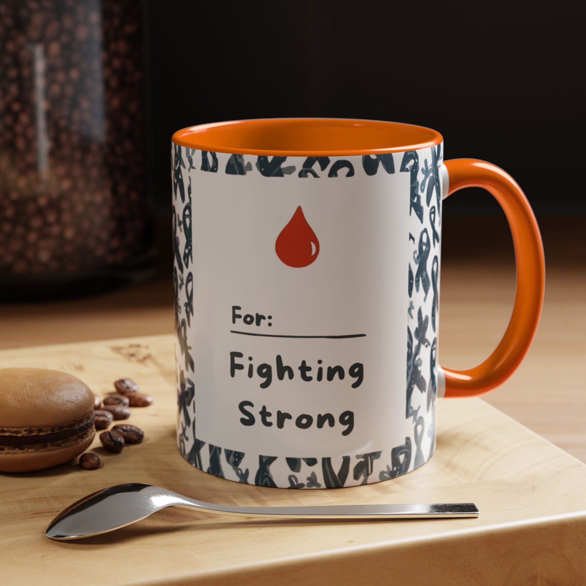 Orange accent diabetes awareness mug on kitchen counter beside coffee beans and spoon — “Fighting Strong” inspirational design supporting awareness.