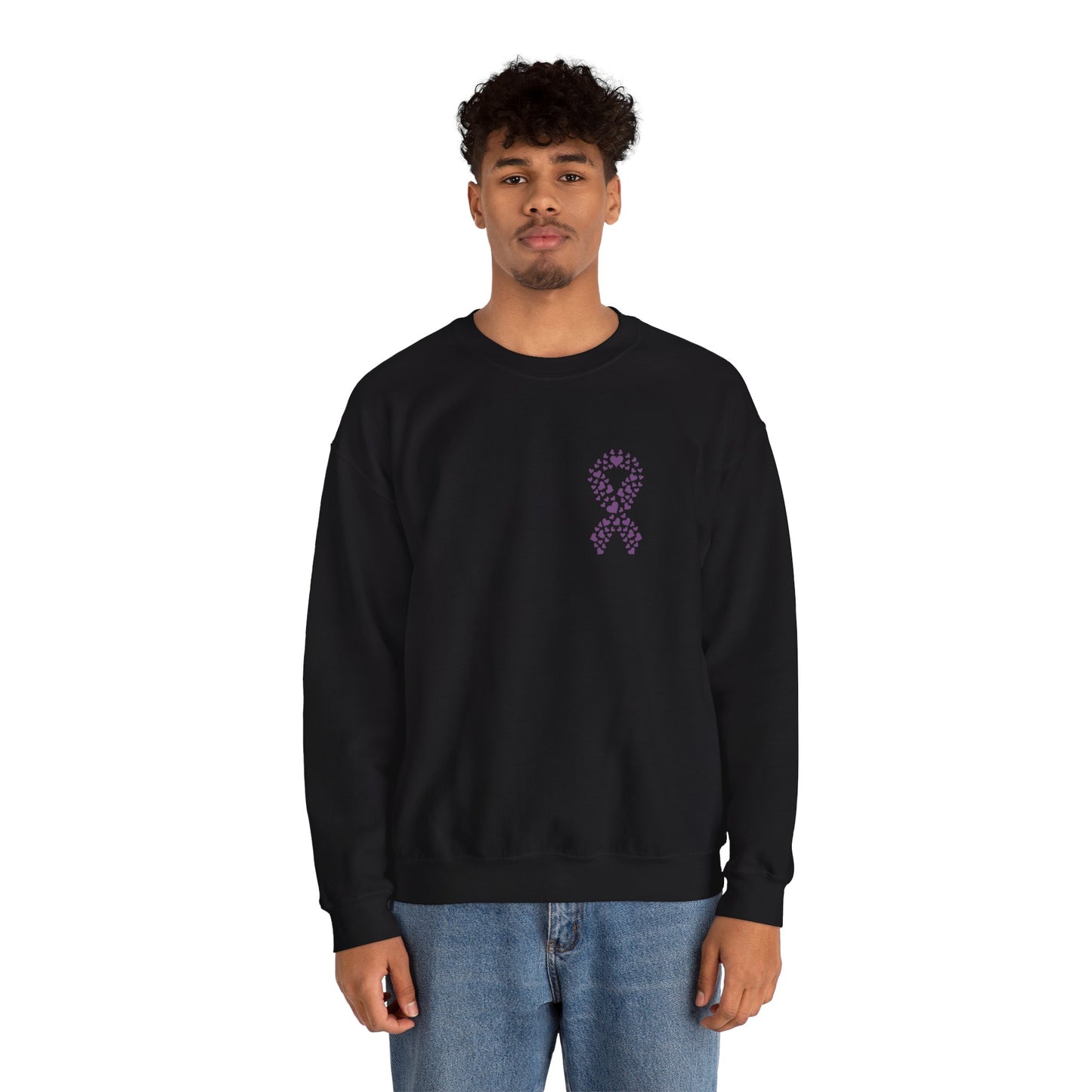 Man wearing black domestic violence awareness crewneck sweatshirt featuring purple ribbon made of hearts, Makin’ It by Lady Ev.