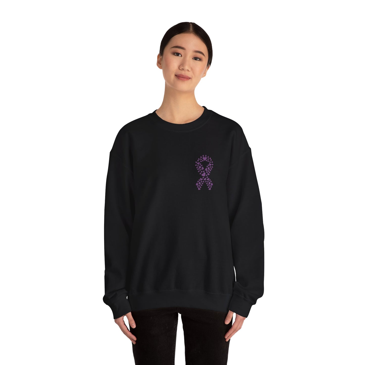 Woman wearing black domestic violence awareness crewneck sweatshirt with purple heart-shaped ribbon graphic, Makin’ It by Lady Ev.