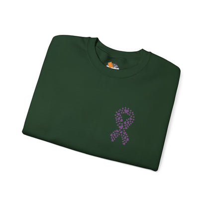 Folded forest green crewneck sweatshirt featuring purple heart-shaped ribbon design for domestic violence awareness, Makin’ It by Lady Ev.