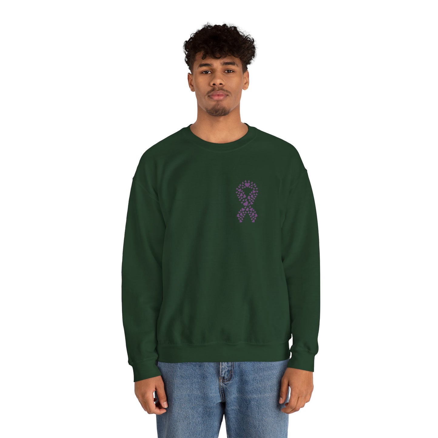 Man wearing forest green domestic violence awareness crewneck sweatshirt featuring purple heart ribbon graphic, Makin’ It by Lady Ev.