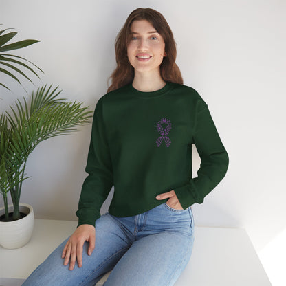 Woman seated in forest green domestic violence awareness crewneck sweatshirt with purple heart ribbon design, Makin’ It by Lady Ev.