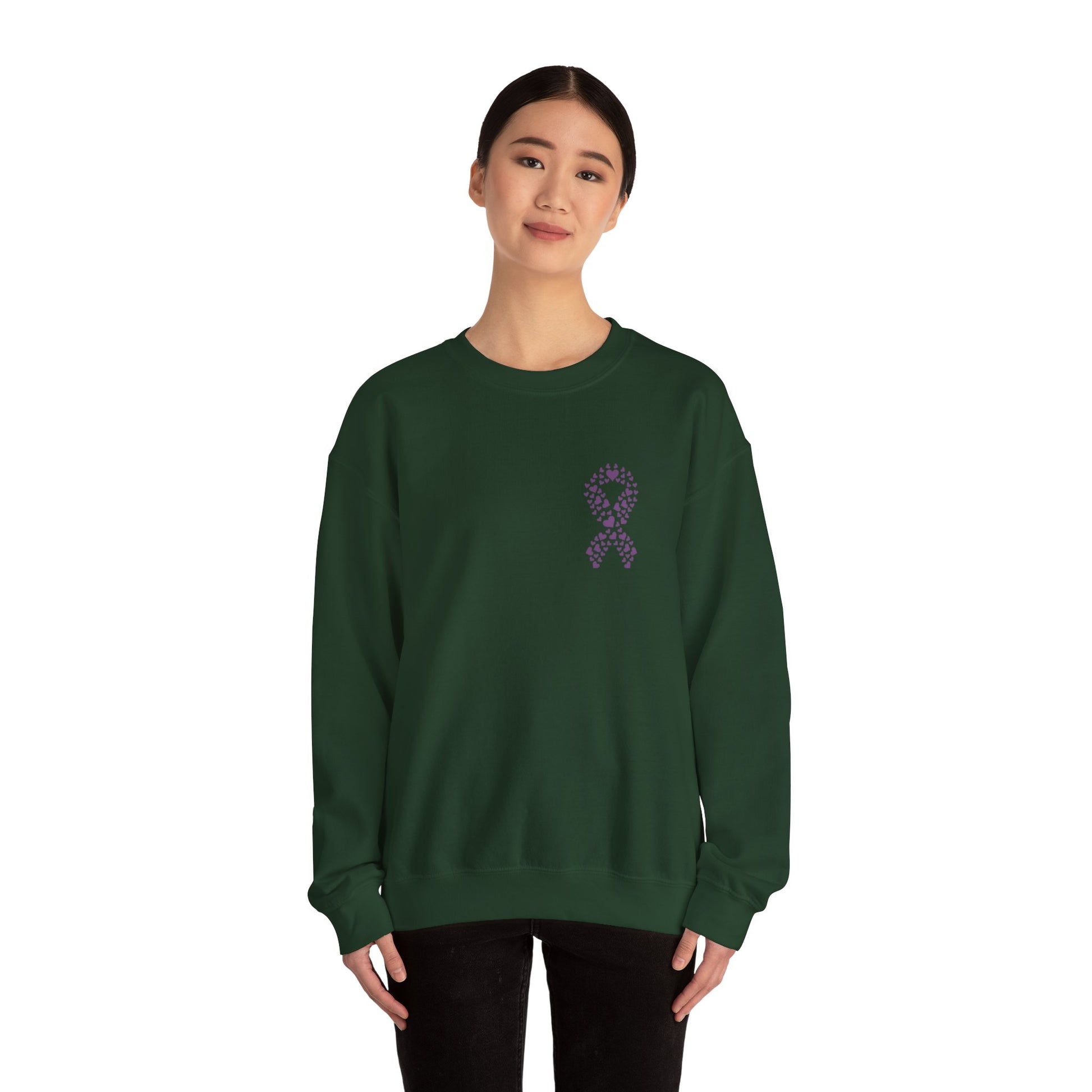 Woman wearing forest green domestic violence awareness crewneck sweatshirt with purple heart ribbon design, Makin’ It by Lady Ev.