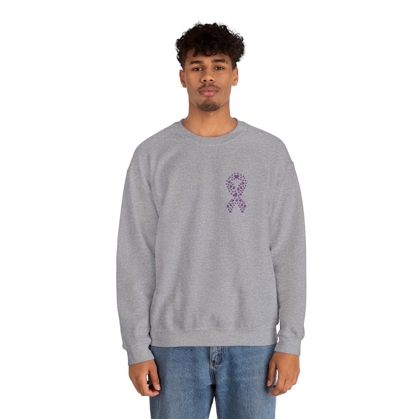 Man wearing heather gray domestic violence awareness crewneck sweatshirt featuring purple ribbon heart graphic, Makin’ It by Lady Ev.