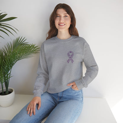 Woman seated in heather gray domestic violence awareness crewneck sweatshirt with purple heart-shaped ribbon, Makin’ It by Lady Ev.