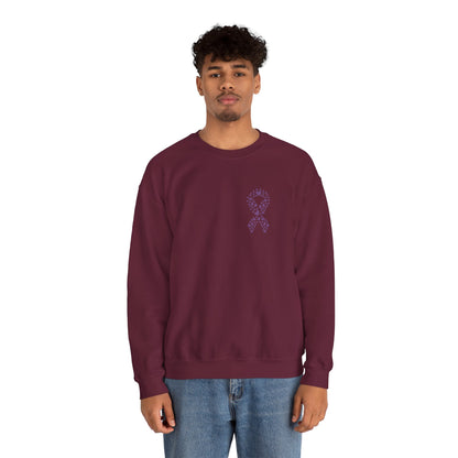Man wearing maroon domestic violence awareness crewneck sweatshirt featuring purple ribbon heart graphic, Makin’ It by Lady Ev.