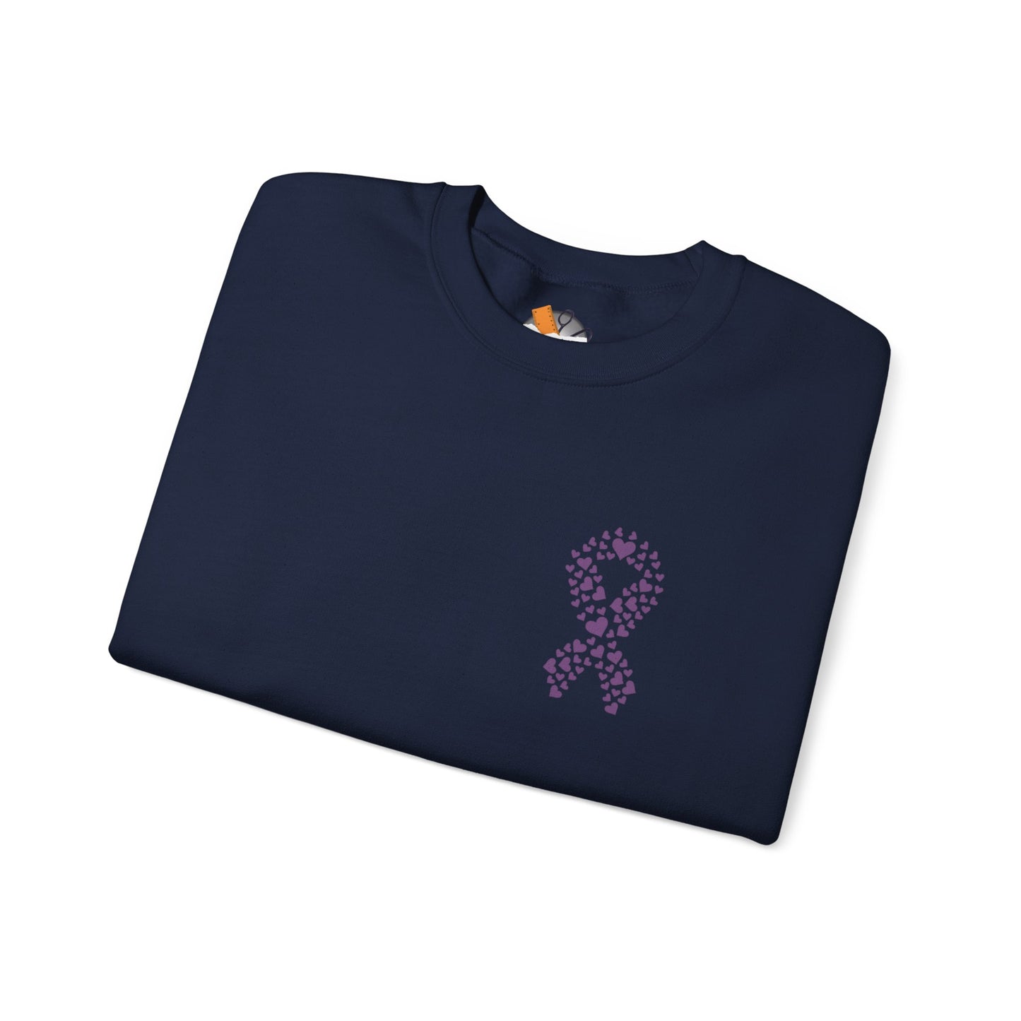 Folded navy blue crewneck sweatshirt featuring purple ribbon of hearts design supporting domestic violence awareness, Makin’ It by Lady Ev.