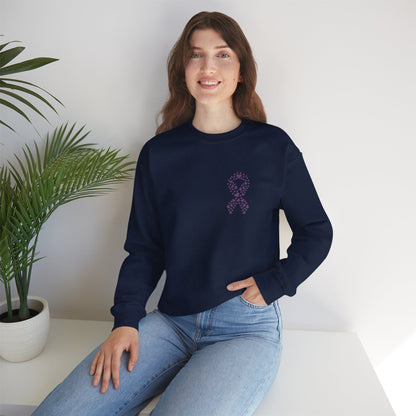 Woman seated in navy blue domestic violence awareness crewneck sweatshirt with purple heart ribbon design, Makin’ It by Lady Ev.