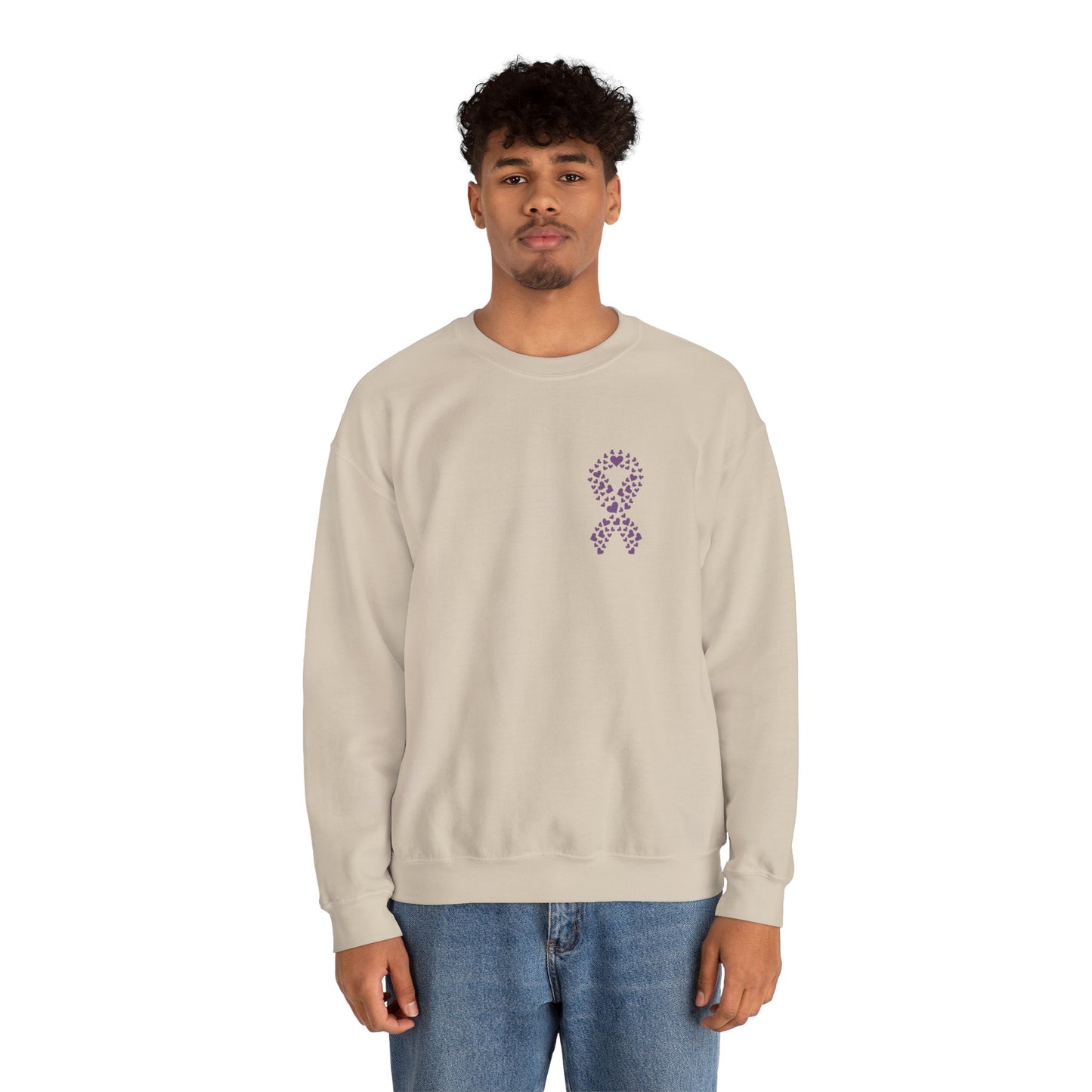 Man wearing sand domestic violence awareness crewneck sweatshirt featuring purple heart ribbon graphic, Makin’ It by Lady Ev.