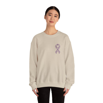 Woman wearing sand domestic violence awareness crewneck sweatshirt with purple ribbon heart design, Makin’ It by Lady Ev.