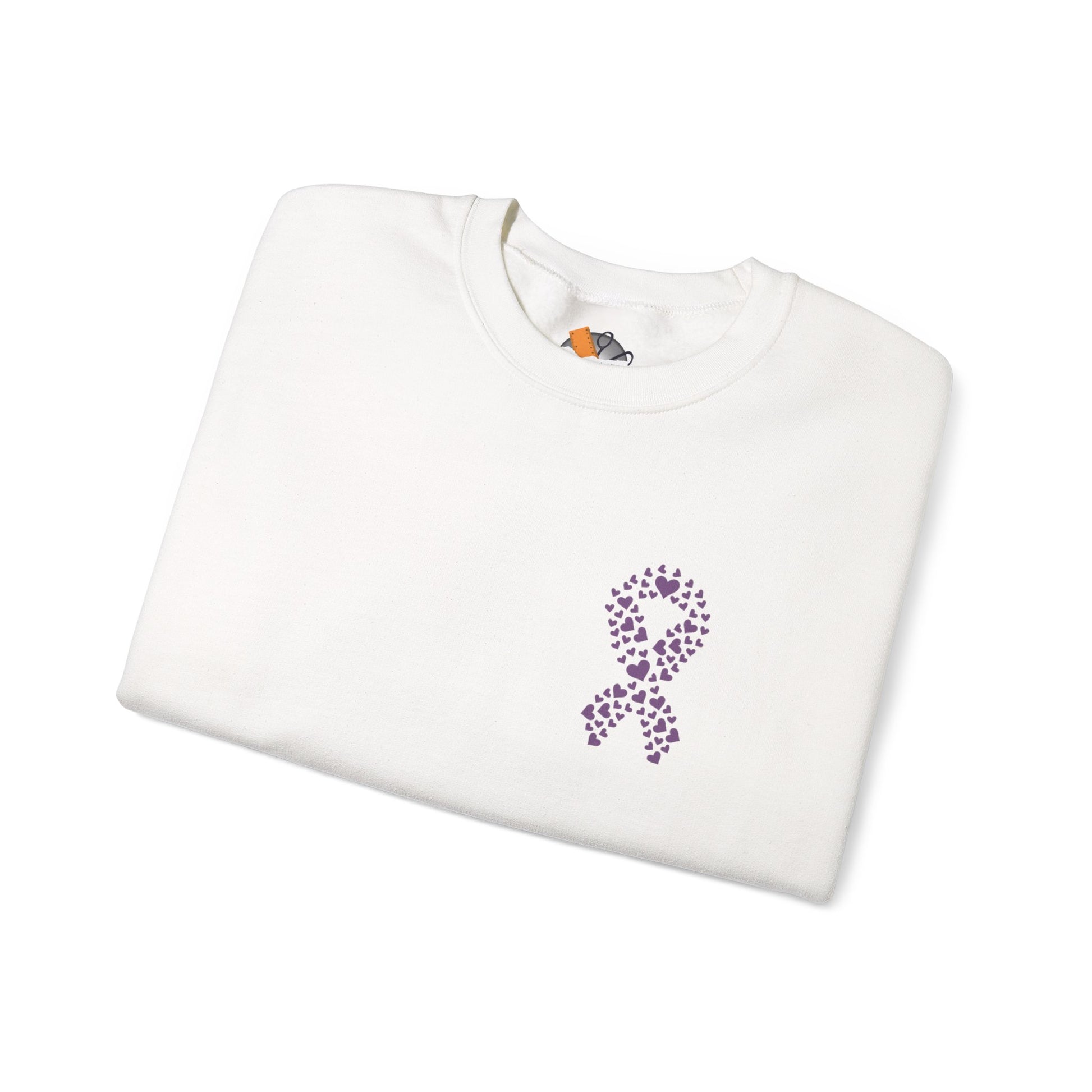 Folded white crewneck sweatshirt with purple heart ribbon design symbolizing domestic violence awareness, Makin’ It by Lady Ev.