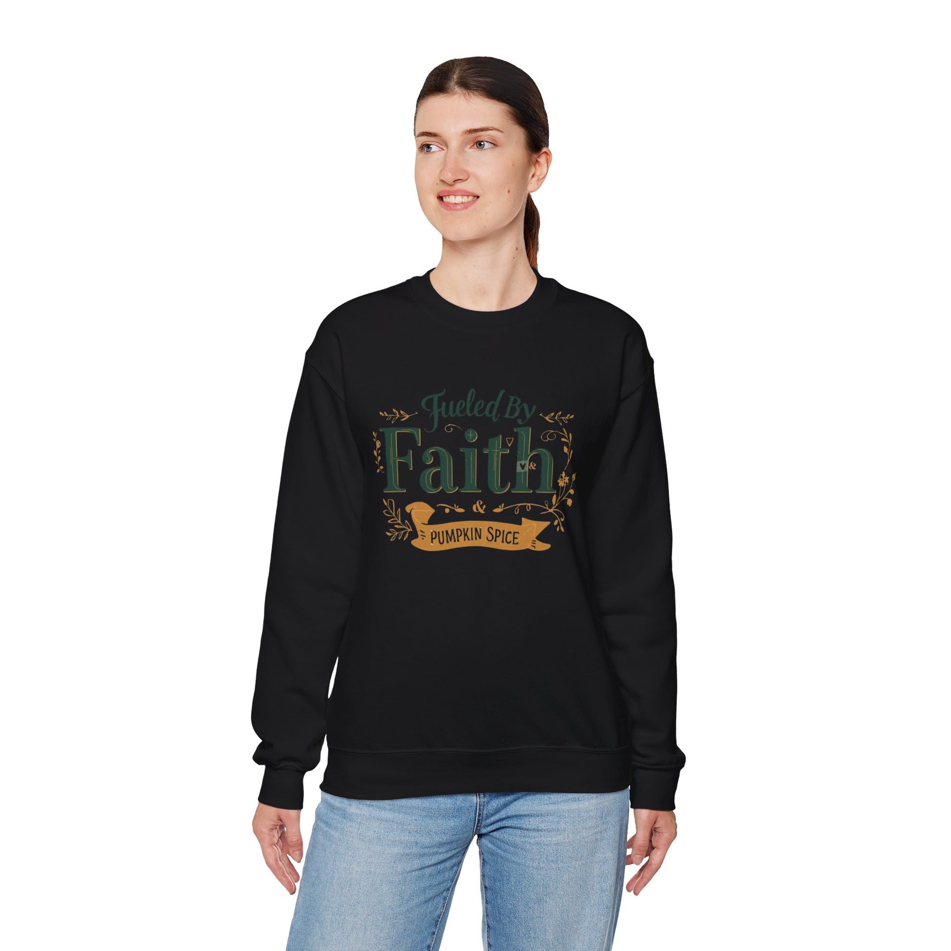 Woman modeling black “Fueled by Faith & Pumpkin Spice” sweatshirt — cozy unisex Christian fall sweater with gold accent design.