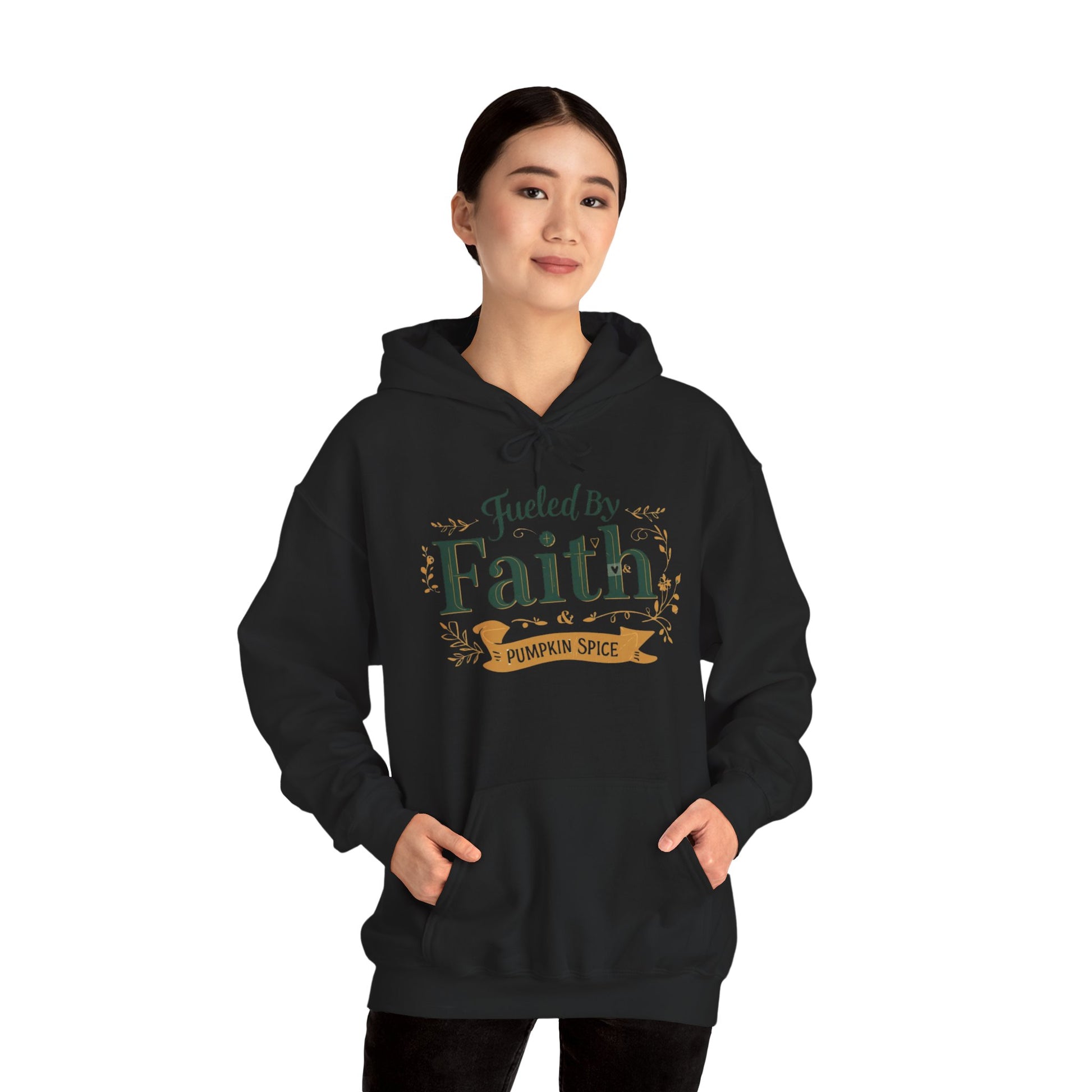 Woman modeling black “Fueled by Faith & Pumpkin Spice” hoodie — stylish unisex Christian hoodie perfect for fall.