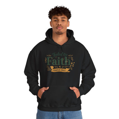 Man wearing black “Fueled by Faith & Pumpkin Spice” hoodie — cozy faith-based fall apparel for believers.