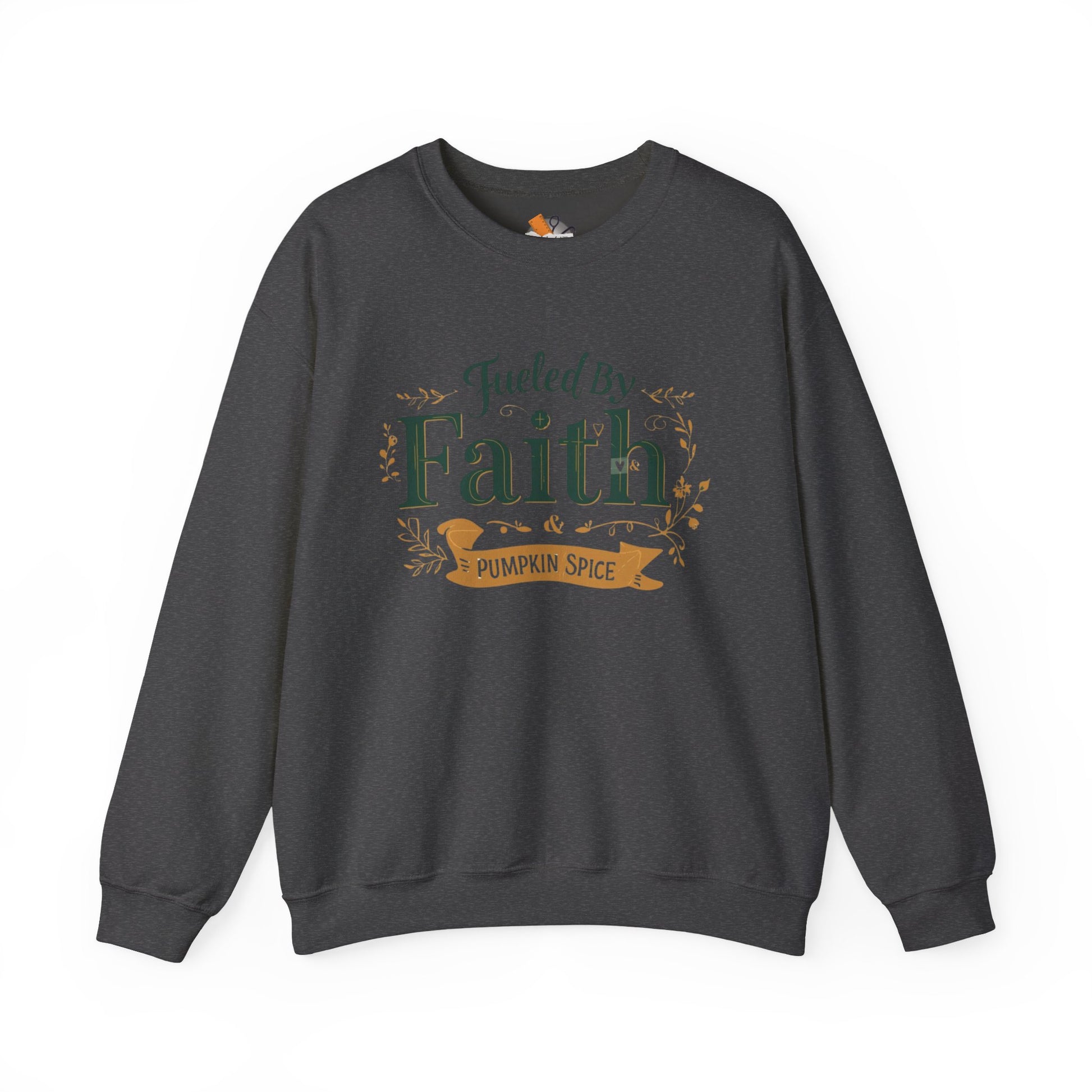 Dark heather gray “Fueled by Faith & Pumpkin Spice” sweatshirt — soft unisex Christian fall crewneck with green and gold lettering.